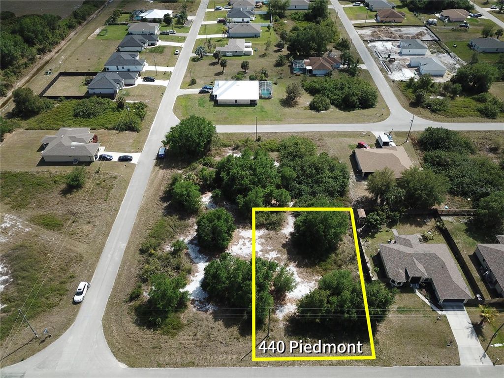 Photo of 440 Piedmont Street, Lehigh Acres, FL 33974 (MLS # O6292502)