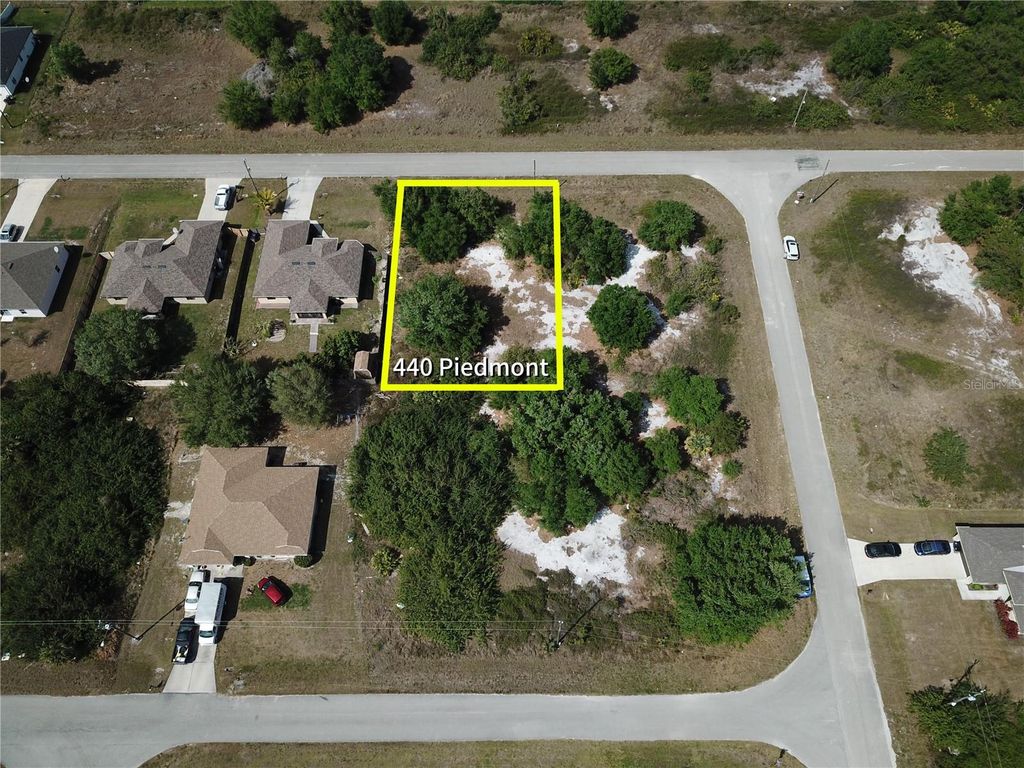 Photo of 440 Piedmont Street, Lehigh Acres, FL 33974 (MLS # O6292502)