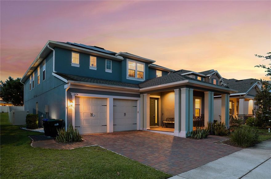 Welcome to 15734 Sweet Lemon Way, an exceptional 5-bedroom, 4.5-bath residence located in the sought-after Highlands at Summerlake Groves community in Winter Garden. Designed with a focus on elevated living, this home showcases luxury vinyl plank flooring throughout, complemented by refined ceramic tile in all bathrooms. The gourmet kitchen is a true centerpiece, appointed with quartz countertops, an oversized island with seating, premium stainless steel appliances, a built-in gas cooktop, a spacious walk-in pantry, and custom 42-inch shaker cabinetry with crown molding and soft-close detail. The open-concept design flows seamlessly into the main living and dining spaces, ideal for both intimate gatherings and larger-scale entertaining. The first floor features a private in-law suite with an en-suite bath, a dedicated office, and a formal dining room. Upstairs, a thoughtfully designed split floor plan offers privacy, with the owner’s suite positioned at the rear of the home and featuring tranquil views, a spa-inspired bathroom with dual vanities, granite surfaces, an upgraded walk-in shower, and an expansive closet. A secondary en-suite bedroom, two additional bedrooms, and a versatile loft space complete the upper level. Outdoors, a private backyard retreat awaits with an extended paver patio, a custom lap pool with sundeck and spa, and a smart Aqualink system for effortless control. The fully paid-off Tesla solar panel system enhances efficiency, while a TechPure whole-home air filtration system supports comfort and wellness. Residents enjoy access to community amenities including walking trails, resort-style pool, sports courts, and playgrounds, all just minutes from Hamlin Town Center, downtown Winter Garden, and convenient access to Highway 429.