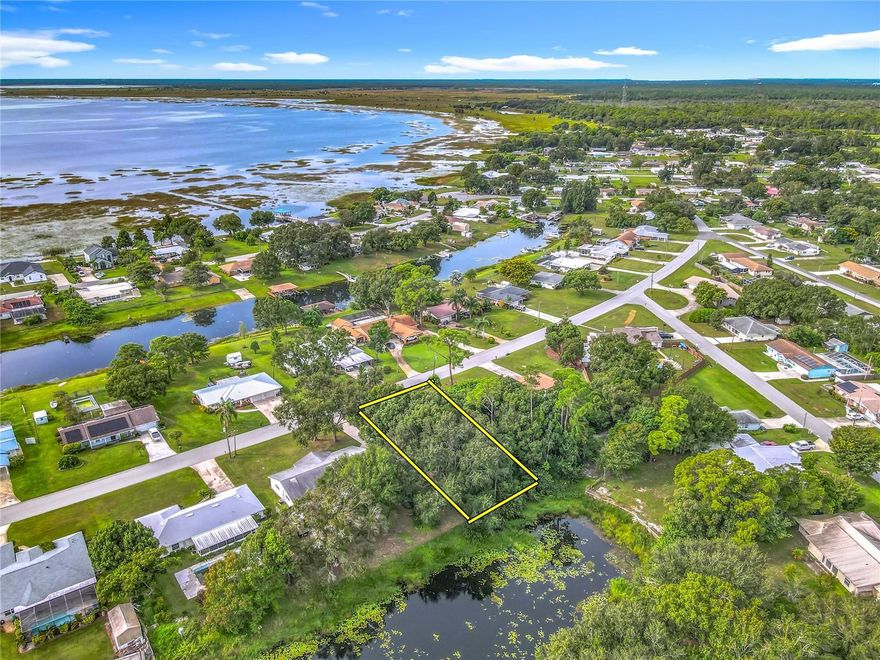 Crooked Lake Canal Front Lot – Direct Access to a 5,500-Acre Spring-Fed Lake!  Build your dream home on this high-and-dry 0.29-acre canal-front lot with direct access to beautiful Crooked Lake, one of Florida’s most pristine spring-fed lakes. Enjoy boating, fishing, and waterfront living right from your backyard!  This property offers quick access to US Hwy 27 and an easy drive to Orlando, Tampa, both coasts, and Central Florida’s world-famous theme parks. Shopping, dining, and employment centers are just minutes away.  With NO HOA and NO deed restrictions, you’ll have the freedom to create the lifestyle you’ve always wanted. Property is in probate and it is anticipated that it will be ready for closing by the middle of December.  Don’t miss this opportunity—call today!