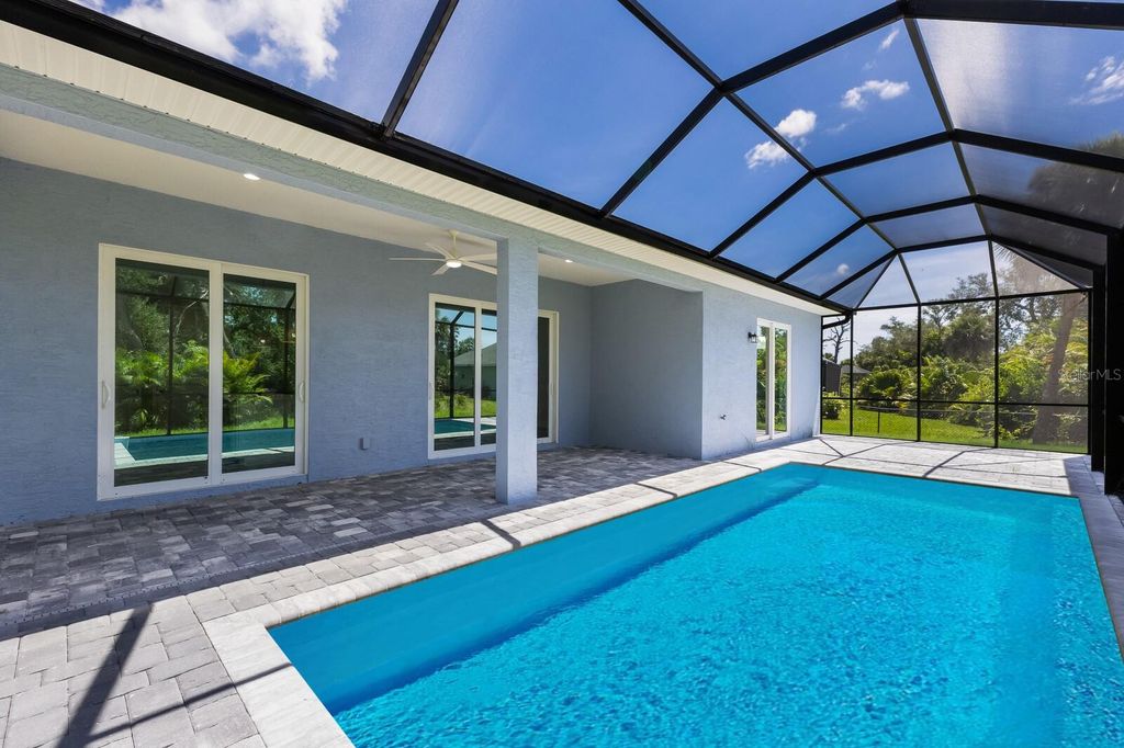 Photo of 105 Spur Drive, Rotonda West, FL 33947 (MLS # C7515183)