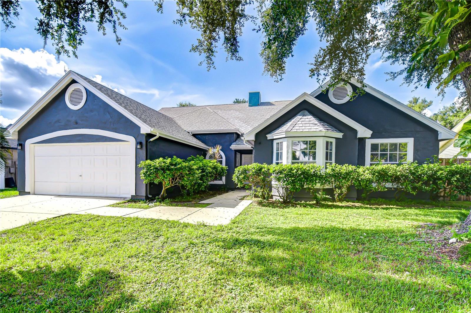 Get ready to fall in love with this fully Remodeled Pool Home with Designer Finishes and a Dream Kitchen! Step inside this beautifully renovated home and prepare to be impressed! Every inch has been thoughtfully updated, starting with a stunning new kitchen featuring sleek stainless appliances, an abundance of 42-inch white cabinetry, elegant quartz countertops, and a massive center island—truly the heart of the home and the perfect gathering spot for entertaining. Luxury vinyl plank flooring flows seamlessly throughout all main living areas, complemented by fresh interior paint and soaring vaulted ceilings that add a bright, airy feel. Plush new carpeting in all bedrooms adds comfort and warmth, making each space feel like a cozy retreat. A cozy wood-burning fireplace anchors the spacious family room and offers direct views of the backyard oasis. A wall of windows and sliding glass doors frame your view of the expansive backyard and sparkling pool—an ideal space to enjoy Florida living year-round. The screened lanai provides the perfect outdoor retreat for relaxing, dining, or entertaining. The large, fully fenced yard is a dream for gardeners, pet lovers, or anyone who wants room to roam and play. The primary suite is a true retreat, offering private access to the lanai, a luxurious, fully remodeled en-suite bath with a soaking tub, walk-in shower, and a massive walk-in closet. Three additional bedrooms provide plenty of flexibility—one features its own en-suite bathroom, and another offers charming French doors, making it a perfect option for a home office, gym, or playroom. Located in a prime area close to top-rated schools, medical facilities, dining, and shopping, this home offers not only stunning updates but also unbeatable convenience. Even better—this community has NO CDD fees and a low, optional HOA, giving you the freedom and flexibility you’re looking for. Don’t miss your chance to own this turnkey beauty with incredible indoor and outdoor living spaces—schedule your private showing today!
