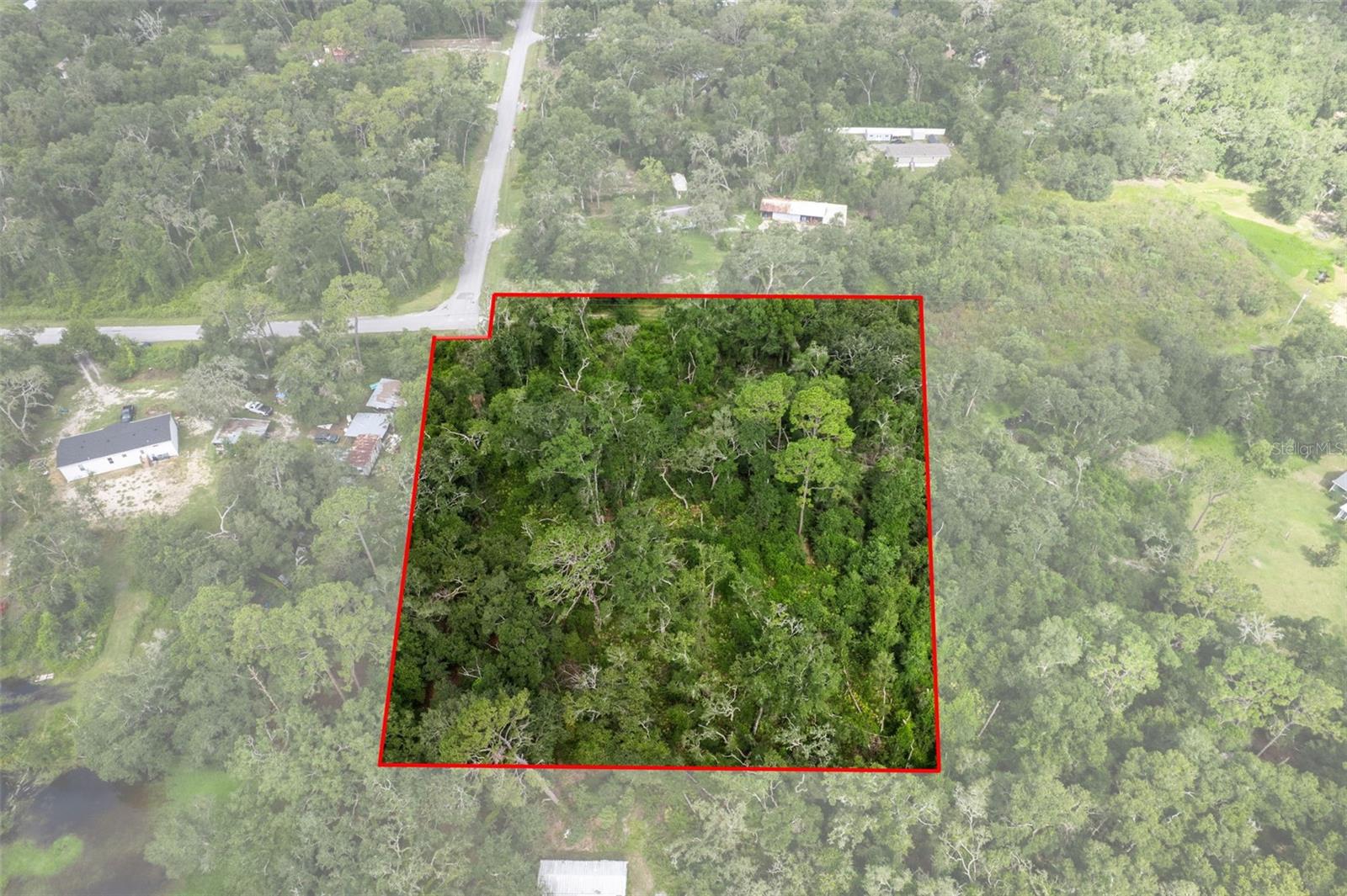 HIGH AND DRY, NO FLOOD ZONE! This Beautiful 2.5 Acre Vacant Lot Is A Rare Find In The Quiet And Established Community Of Royal Oaks Retreats. Located on a paved road with onsite utilities! Zoned RR1 which allows Class A & B Mobile homes, Manufactured, Single family, and Modular homes! This Property Offers Incredible Flexibility To Build Your Dream Home Or A Promising Investment Project. With No HOA, You’ll Enjoy More Freedom And Fewer Restrictions, Allowing You To Make The Most Of This Expansive Parcel, Making It Ideal For A Variety Of Building Plans. Located Just Minutes From Shopping, Dining, And Local Conveniences, You’ll Appreciate The Perfect Blend Of Privacy And Accessibility. Whether You're Looking To Build Now Or Hold For Future Development, This Property Presents Endless Possibilities. Don’t Miss Out On This Unique Opportunity—Schedule Your Showing Today! Lot is directly north of 4914 CR 683D-1