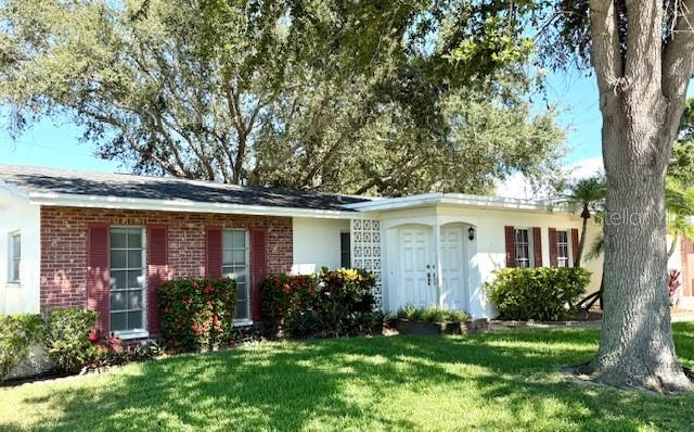 Stunning, mature live oak trees dominate the front and back yards of this beautiful corner-lot home. Seller is the original owner and designer of this custom-built 4-bedroom home, built in 1967. Their children and grandchildren attended the nearby elementary, middle and high schools. Now this home only needs your vision to transform the dated interior into a 21st-century jewel and MAKE IT YOURS! And while you're at it, there's room in the back yard to carefully install a pool or spa without disturbing the sentinel live oaks. This 1,794 sq. ft. home is located in the Woodland Hills subdivision, a part of unincorporated Pinellas County. The county has just completed a beautiful rehabilitation of the neighborhood's sidewalk system, so children can safely play and easily walk to and from nearby Oakhurst Elementary School. The maps locate this home as a corner lot, but please note that Sunset Drive along the home's southern boundary has been blocked by the county as a through street for decades. No through traffic at all, another safety plus. Speaking of location, the adults can ride their bikes across the bridge to nearby Indian Rocks Beach. Tampa International Airport, downtown St. Petersburg and downtown Clearwater are all about 30 minutes away. Back at the home, the older carpeting has been removed to reveal the original terrazzo flooring throughout the home. Bring it back to its original luster or install a newer flooring to compliment your new interior. The home's roof was replaced in 2017, as documents will show. Yes, this home needs some time and effort, but the asking price puts it at a price point that will reward the new owners who appreciate having a beautiful home in a beautiful setting in a beautiful residential neighborhood that's a destination location for a growing family. The home's owner for the past 58 years can vouch for that.