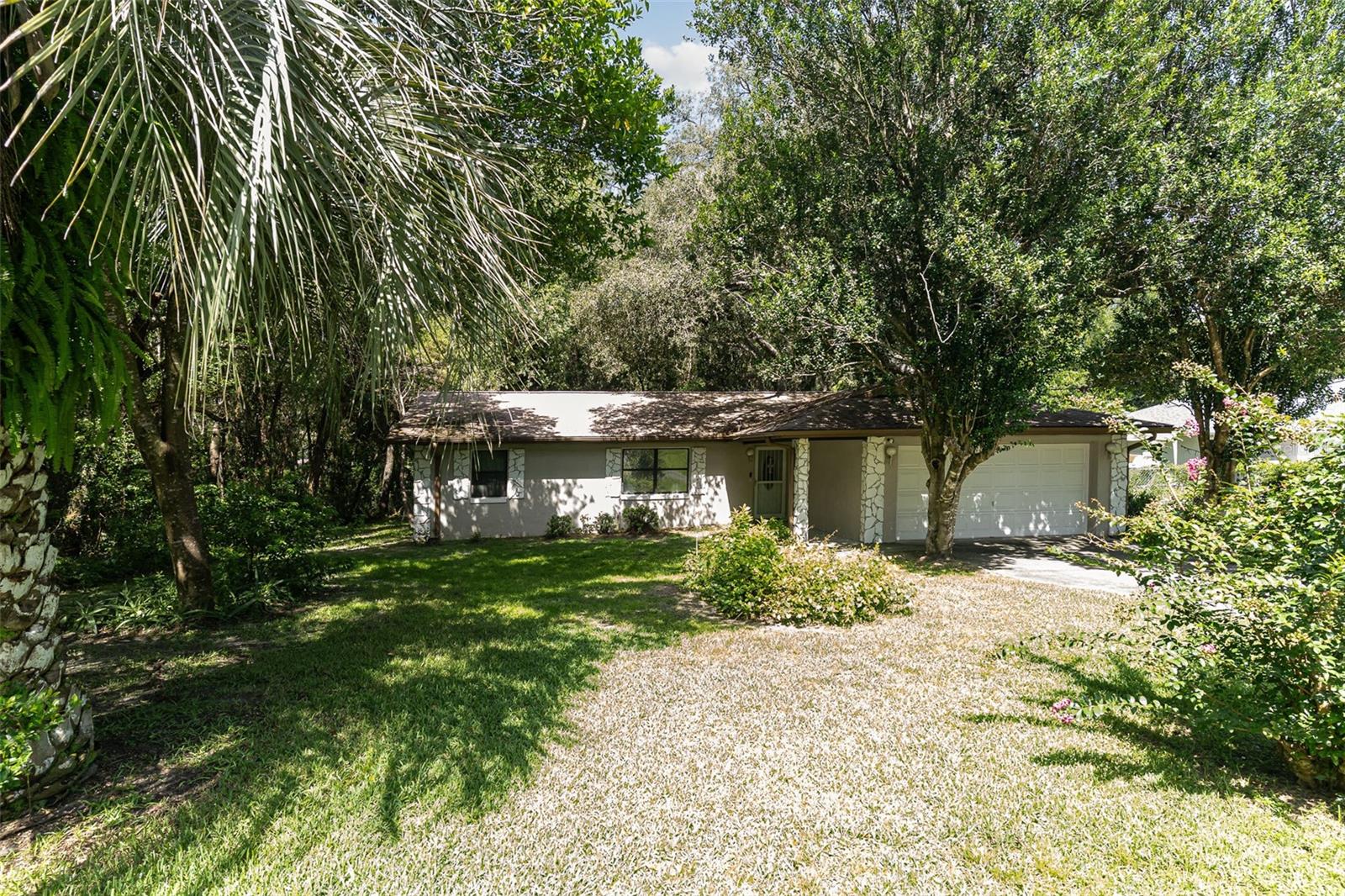 Welcome to your dream home! This beautifully maintained 3 bedrooms, 2 bathrooms residence offers the perfect blend of comfort, functionality, and style. The home boasts a spacious open layout with stylish vinyl wood flooring throughout—no carpet in sight. . The kitchen is seasoned with love and is perfect for entertaining your guests, featuring lots of cabinets and extended counter space. The kitchen is the heart of the home. The modern kitchen includes an eat-in area, brand-new appliances, and opens directly to the living room, creating a seamless and inviting space perfect for both everyday living and entertaining. Step inside to a large family room and an open-concept highlighted by a cozy wood-burning fireplace—perfect for relaxing evenings. The 2-way split floorplan is perfect for your extended family with owners retreat on one side of the home with 2 bedrooms and a full bathroom separated. This home is full of endless possibilities. Master suite offers a spacious room with a large walk-in closet. Master bathroom offers a walk-in shower. Time spent on the lanai is time well spent. Flip flops are highly recommended, wear lots of sunscreen, relax, hang up your towel, soak up the sun and swim in the private pool Relax and enjoy as there will be a lot of sipping, grilling and chilling with an amazing screened lanai overlooking the peaceful backyard oasis ideal for morning coffee or evening relaxation. Life is too short to fold fitted sheets but convenient in the large laundry room. A brand-new roof was installed in 2021, New pool pump and new HVAC system (complete inside and outside unit) installed in 2025, pool deck was resurfaced in 2025, giving you added peace of mind. This home offers a lifestyle you’ll love coming home to. This home is conveniently located close to Citrus Springs, you’ll be just minutes from the Withlacoochee State Trail for biking and jogging, Rainbow Springs State Park for kayaking and swimming, and the Citrus Springs Golf & Country Club.