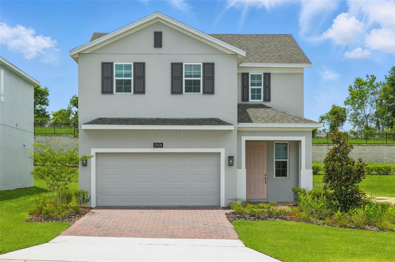 Discover the spacious and stylish Gasparilla plan in Eagletail Landings, where modern design meets everyday comfort! This thoughtfully designed home offers 5 bedrooms, 2.5 baths, including a desirable first-floor Primary Suite with a luxurious en-suite bath featuring adult-height vanity with dual sinks, quartz countertops, a large walk-in shower, and generous walk-in closet. The open-concept main floor boasts soaring 9'4" ceilings, elegant tile flooring, and a beautifully upgraded kitchen with 42" white cabinets with crown molding, quartz counters, pantry closet, and stainless steel appliances, including refrigerator. A versatile second-floor Bonus Room adds extra space for work or play, while the exterior features attractive landscaping, and brick paver driveway and lead walk. Blinds are included throughout, along with a full laundry setup—washer and dryer included! Future Community amenities will include Resort-style Pool and shaded Playground. Eagletail Landings is located just south of Lake Harris and near some of the best outdoor recreation in the state as well as Lake County's breathtaking chain of lakes and scenic trails, and a thriving downtown area is just a short drive away, along with 2 nearby championship golf courses designed for a challenging and enjoyable day on the greens.
