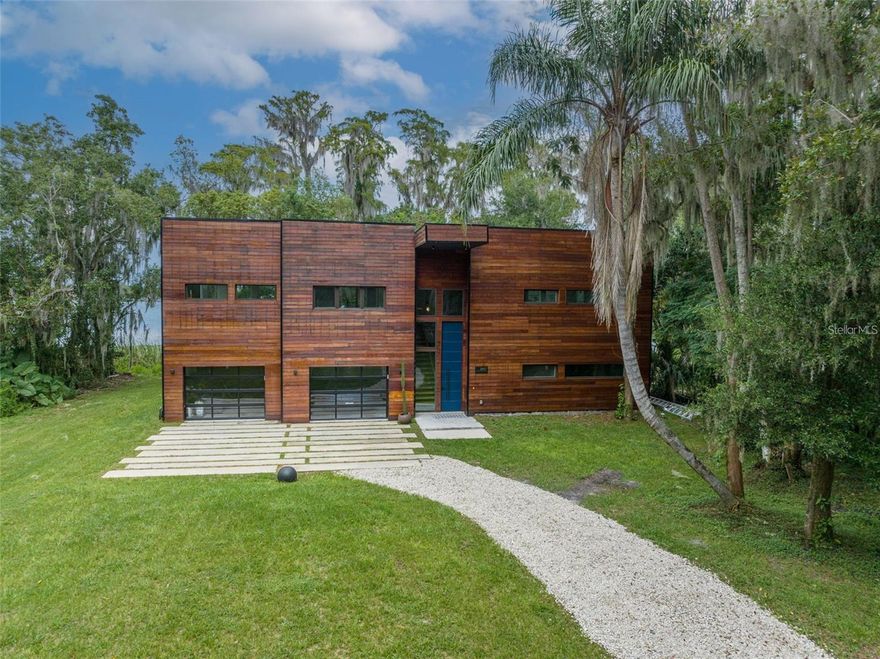 Drive down the long private road surrounded by indigenous plants and trees, taking you out of the city and to your own
very secluded lakefront oasis. As you pull into the driveway you will see the amazing newly built modern contemporary lake front home. The
beautiful Brazilian hardwood sided house will impress everyone that comes to visit you. The first floor boasts two bedrooms and two baths A gym
and laundry room. The contemporary design comes through in the floating staircase and the polished cement floors. Climb the stairs to enter the
open concept main floor including the large primary suite. The large windows giving you the lake views that you have been looking for. The
second floor oversized deck with an Argentinian fireplace/BBQ, will be the place to entertain your guests. Don't miss your opportunity to be the
owner of this one of a kind home.