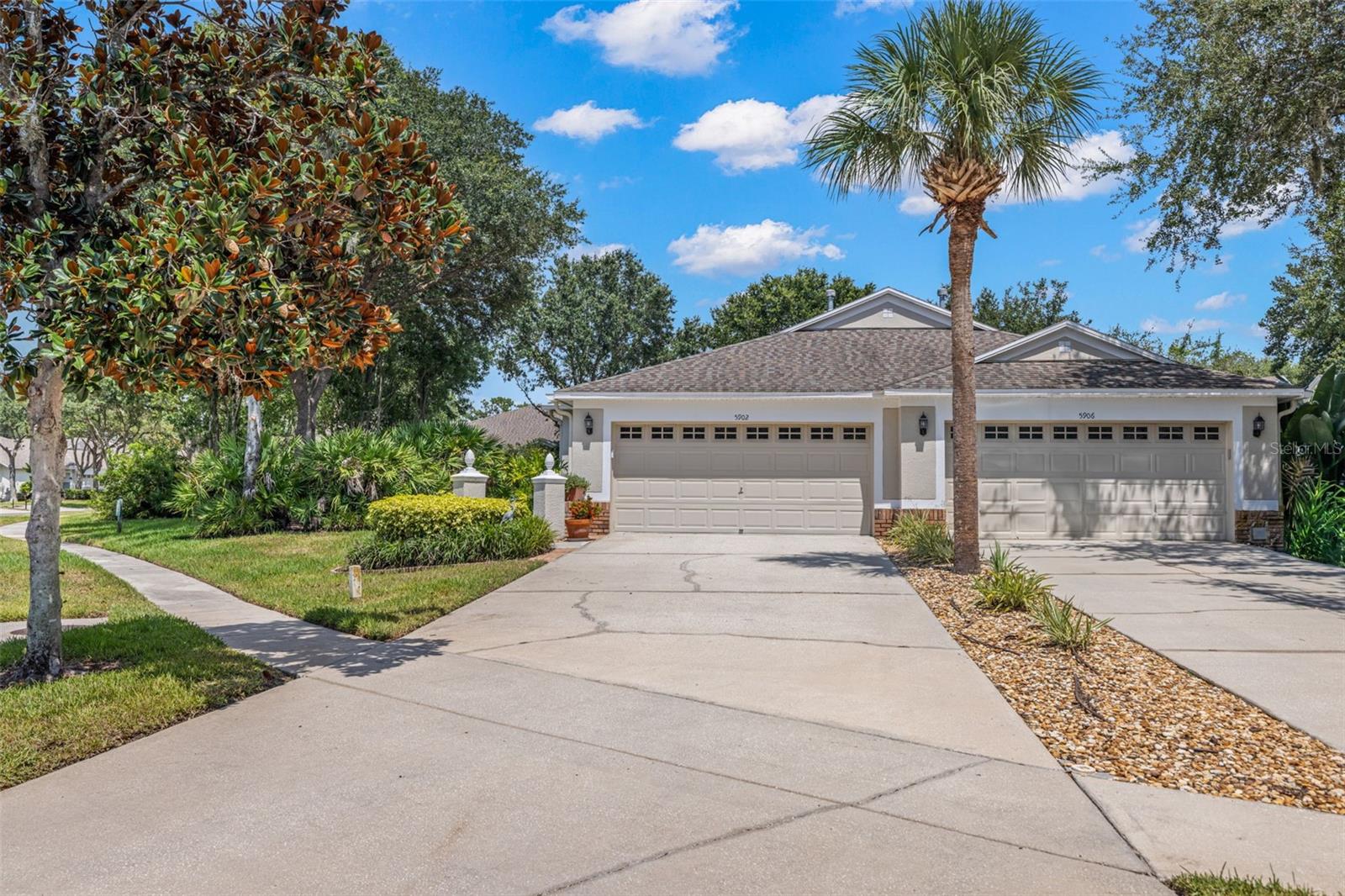 Welcome to this Beautifully Updated 3 Bedroom, 2 Bath Villa in the Gated Phoebepark community of FishHawk Ranch! Featuring 1,828 sqft of open living space plus an additional 473 sqft of enclosed, covered patio, this thoughtfully upgraded home offers comfort and functionality throughout. Step inside to a storm-resistant front door and transom window that fill the entryway with natural light. Gorgeous engineered hardwood floors and a bright, open layout connect the upgraded kitchen to the dining and living areas, perfect for entertaining or everyday living. The upgraded kitchen features beautiful sage cabinets, solid-surface countertops, stainless steel appliances, induction cooktop convection oven, pull-out pantry shelving, and a movable center island that's ideal for prep or coffee bar use. There's also a cozy breakfast nook for casual dining. The spacious primary suite is a true retreat with tray ceilings, extra space for sitting & existing storage cabinets, two custom walk-in closets, and a fully renovated ensuite bath with dual vanities and a walk-in shower. The split floor plan offers privacy with two additional bedrooms, one is set up as a home office with a built-in desk system, and the other offers easy access to an upgraded full guest bath. All closets feature upgraded wood shelving, and both bathrooms are equipped with comfort-height toilets for added accessibility. Enjoy practical touches like a laundry room with upper cabinets, a newer washer/dryer, and direct access to a 2-car garage with an extended driveway that fits up to 4 vehicles. Love outdoor living? You’ll appreciate the enclosed, covered lanai with newer flooring, a newer insulated roof structure, and a peaceful setting for morning coffee or evening relaxing. Upgrades galore! Plantation shutters throughout, crown molding, energy-saving window and door film, Leaf Filter gutter guards, a whole-home water softener system, and updated light fixtures. Even better? The HOA covers the roof, exterior paint, landscaping, and lawn care, making maintenance a breeze. Phoebepark residents also enjoy their own private pool plus full access to FishHawk Ranch’s resort-style amenities: miles of walking trails, multiple clubhouses, fitness centers, aquatic center, pickleball, tennis, basketball, skate park, playgrounds, dog parks, and more! All of this is just a short walk to Park Square with restaurants, splash pad, fitness options, and community events. Zoned for top-rated FishHawk schools and an easy drive to Tampa, Orlando, St. Pete, and the beaches! This one checks every box including location, upgrades, low-maintenance living, and unbeatable amenities. Come see it before it’s gone!