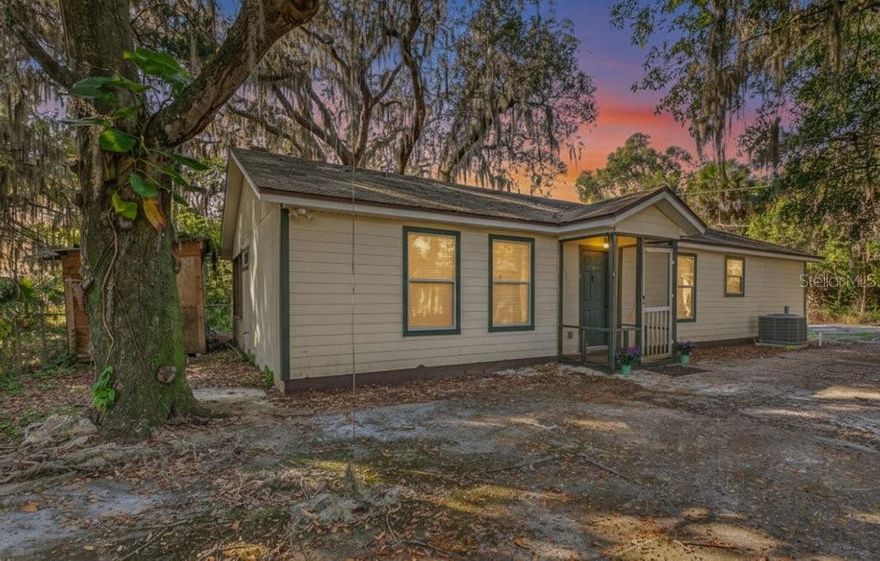 Beautifully maintained 2BR/2BA home in the heart of West Augustine, less than 2 miles from Historic Downtown St. Augustine. Nestled beneath towering oaks, this home offers a peaceful setting in an eclectic, fast-growing neighborhood surrounded by new construction and revitalized properties. The split floor plan provides excellent privacy, while the living room centers around a cozy fireplace. The kitchen features a breakfast bar and opens to a dedicated dining area, creating an inviting space for everyday living or entertaining. Enjoy the spacious screened porch for year-round outdoor relaxation, along with a large separate laundry room with extra storage for added convenience. Private screened porch graces the back of the home. Just steps from local restaurants and commercial spots, this location offers walkable access and strong investment potential—ideal as a primary residence, rental property, or weekend retreat. Zoned RS3 which allows daily rentals with registration.  Located in Flood Zone X, this property does not require flood insurance. RS3 allows daily rentals.