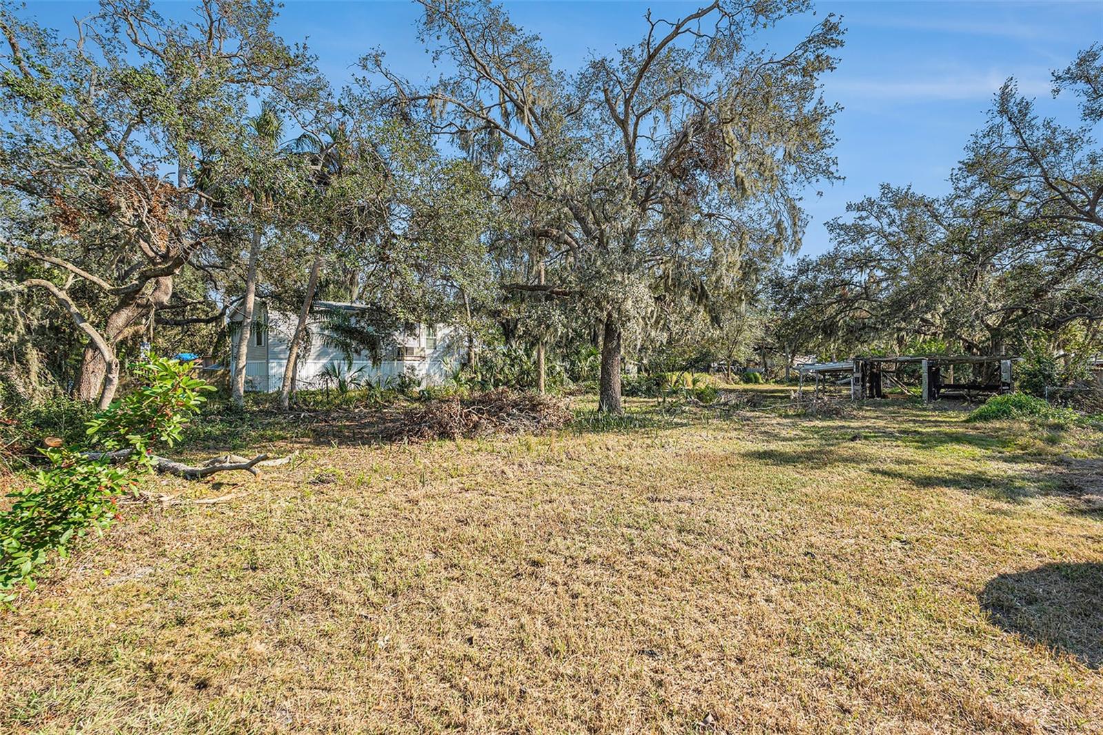 NO HOA, NO CDD. Discover the perfect canvas for your next project with this 0.34-acre lot tucked away on Palm Avenue in Gibsonton. Whether you’re a builder, investor, or future homeowner, this property offers a rare combination of peaceful surroundings and convenient access to highways and restaurants. The lot is partially cleared with beautiful mature trees framing the space, giving you the flexibility to design your ideal home while enjoying natural privacy. Its location provides easy access to US-41 and I-75, making commutes to Tampa, Brandon, and surrounding areas quick and seamless. Nearby, you will find the Alafia River, which is perfect for boating and fishing. Whether you’re planning a custom single-family residence or looking to hold land as a long-term investment, this lot is a smart choice. Schedule your tour today.