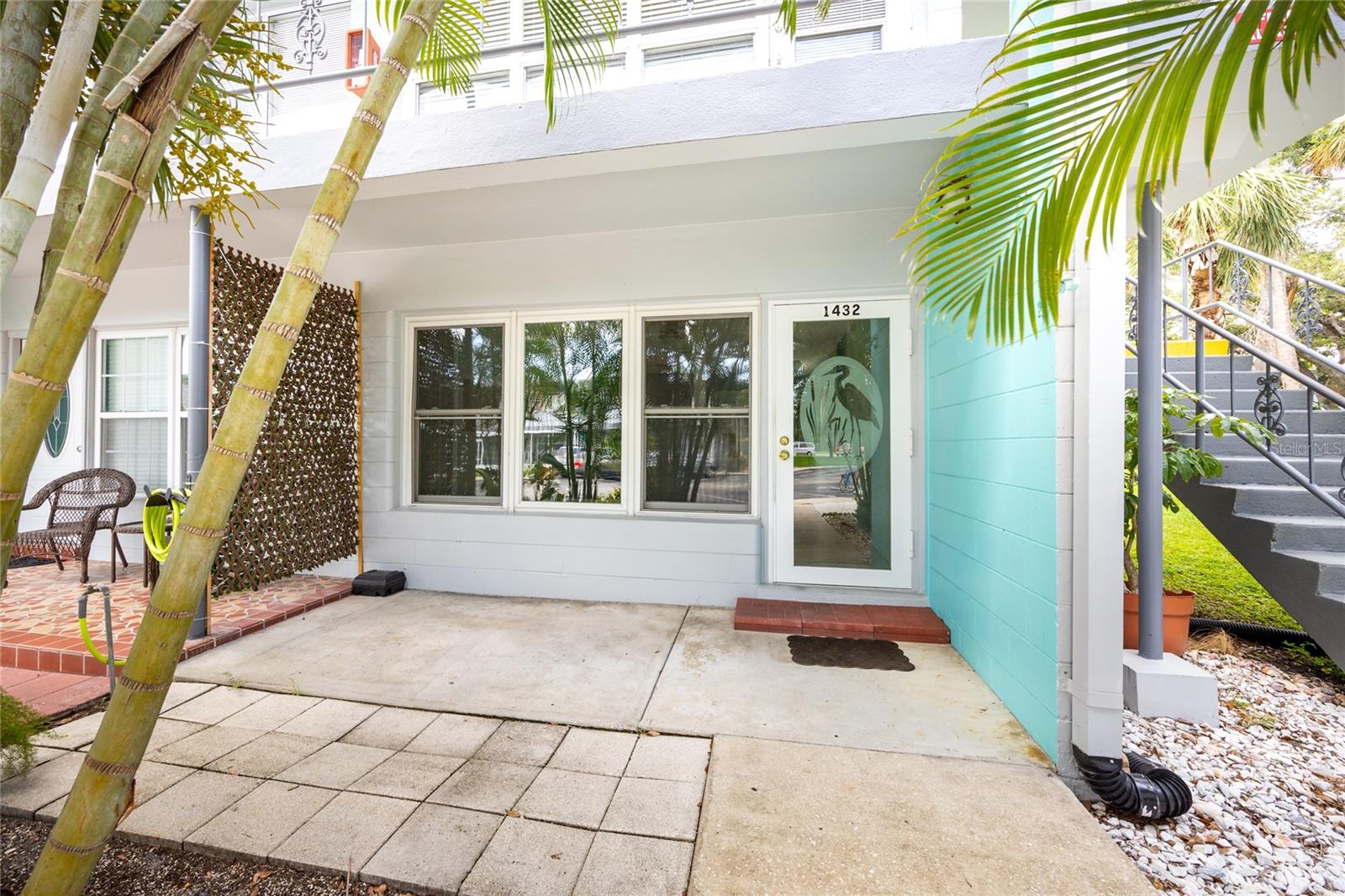 Rare ground-floor end unit in 55+ Palms of Paradise! Welcome to this rarely available 1-bedroom, 1-bathroom ground-floor end unit with a versatile bonus room—perfect for an office, guest space, or hobby area. Located in the well-kept, pet-friendly Palms of Paradise (formerly Clearview Oaks), this condo combines comfort, convenience, and peace of mind. Featuring impact-rated windows, a 2020 HVAC system and water heater, and in-unit washer/dryer plumbing already in place, this home is move-in ready. You'll enjoy a convenient dedicated parking space with extra storage, too. Residents love the community’s vibrant atmosphere with a clubhouse offering planned activities, a library, billiards, and shuffleboard courts. Beautifully maintained grounds include community sump pumps adding extra security during rainy seasons. Affordable monthly fees cover internet, Wi-Fi, cable, water, sewer, trash, building insurance, and grounds maintenance. With no leasing allowed, the community maintains a friendly and stable environment. Ideally located in Kenneth City, you're just minutes from shopping, dining, public transportation, and the Northwest Community Recreation Center—plus a short drive to downtown St. Pete, award-winning Gulf beaches, and Tampa International Airport. Best of all, this unit has never flooded, offering added peace of mind. Don’t miss this opportunity to live in one of the area’s best-kept secrets!