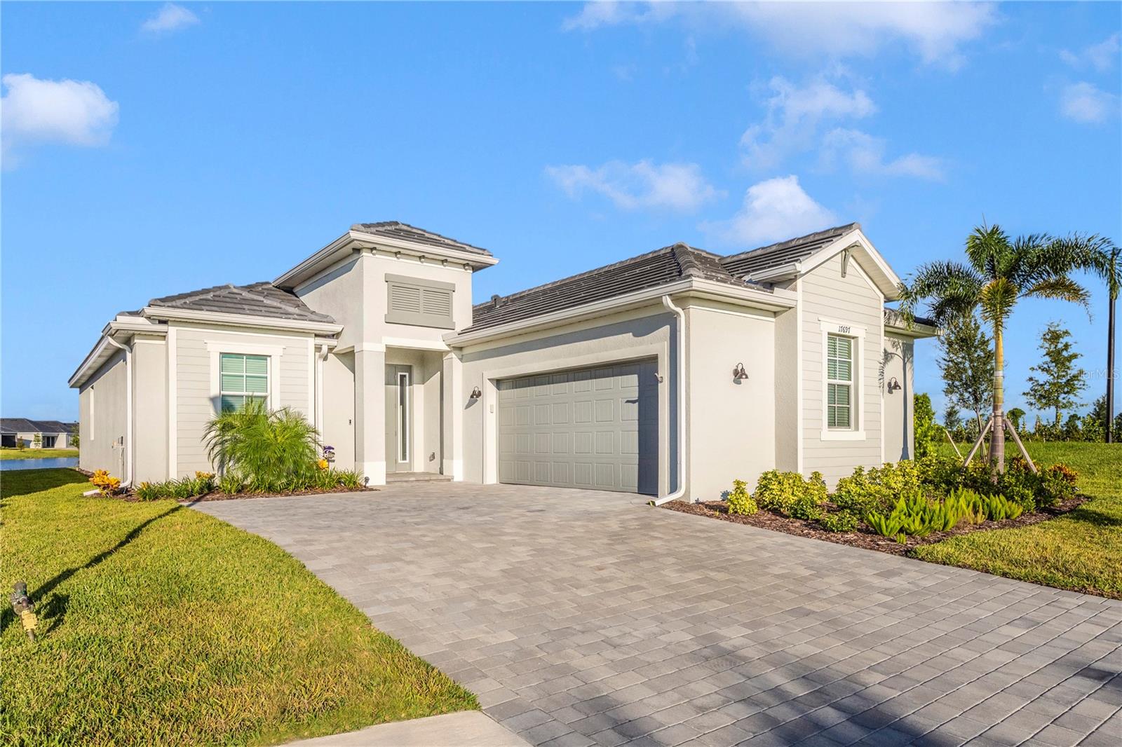 Brand New - Beautifully furnished and fully turnkey 2BR + den / 2 1/2BA single family home with a 2-car garage in a highly sought-after gated golf course community, Wellen Park Golf & Country Club! Available for monthly rentals, this spacious and stylish home is ideal for seasonal residents or investors. The open-concept layout features a bright and airy living space, split bedroom floor plan for privacy, and a versatile den perfect for a home office or guest room as it includes a pull out sofa. The kitchen is fully equipped and opens to the dining and living areas—ideal for entertaining. Enjoy your morning coffee or evening glass of wine on the private screened lanai with gorgeous water views.
This home is located just steps from world-class community amenities including professional 18 hole golf course, tiki bar, resort pool and spa, pickleball & tennis courts, fitness center, full time activities director, dog park and more. Conveniently located near shopping, dining, and beaches, with easy access to major highways and airports. Just bring your suitcase—everything else is here!