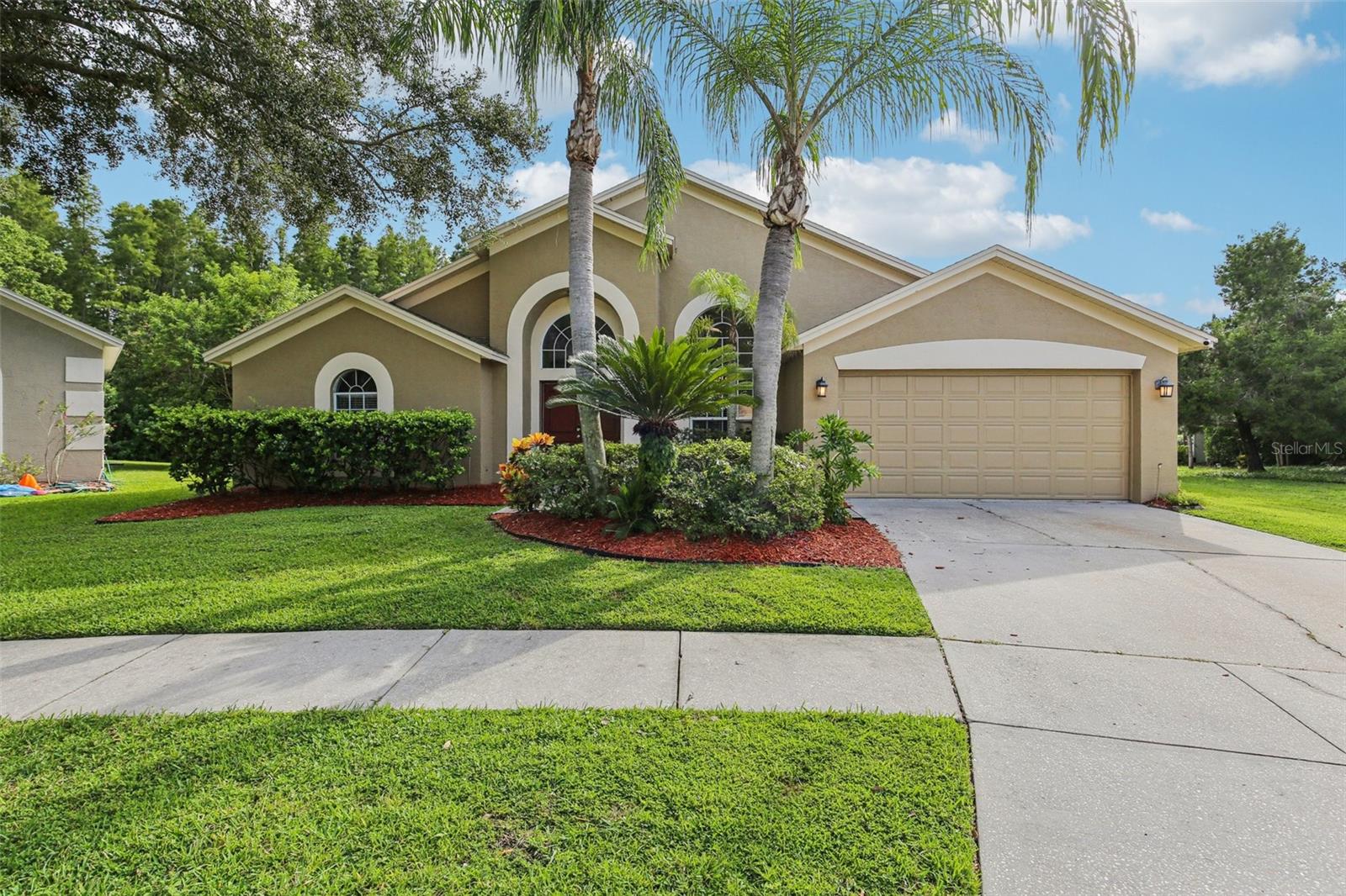 Welcome to this beautifully maintained 4 bedroom, 3 bathroom pool home located in the sought-after community of Calusa Trace, known for its low HOA fees, no CDD, and top-rated schools. This home offers a functional layout with formal living and dining rooms up front and an open-concept kitchen and family room overlooking the screened pool and lanai. The split-bedroom floor plan provides privacy, and large windows bring in natural light with peaceful views of greenery and a pond—no rear neighbors.
Recent improvements include: roof (2016), plumbing re-pipe (2021), air conditioner (2020), new flooring in main areas (2021), pool pump (2024), pool filter (2025), interior and exterior paint and seal (2024), garage door opener (2025), new front doors (2024), and full lanai screen replacement (2021).
Location is everything – just minutes from shopping, dining, St. Joseph’s Hospital, the Veterans Expressway/Suncoast Parkway, and Tampa International Airport.
If you’re searching for a move-in ready home with a private pool, a smart layout, and the reassurance of recent big-ticket updates, this is the one!