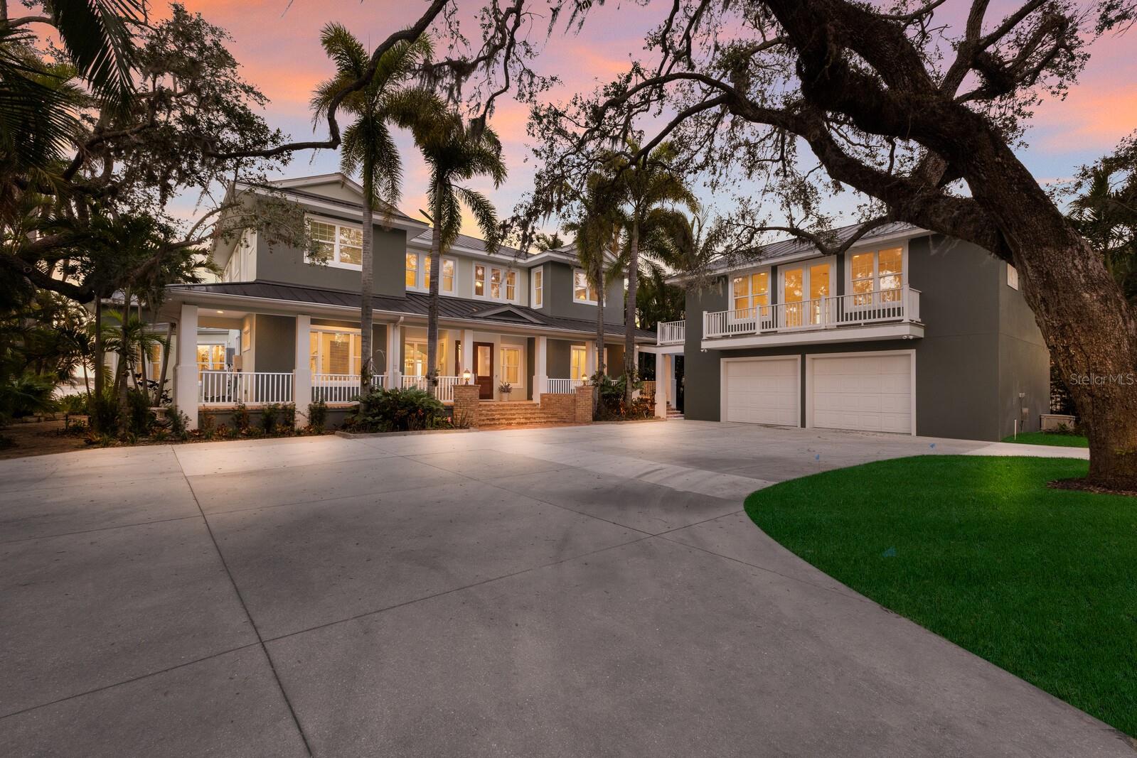Elegant riverfront home with stunning views! This exquisite 4-bedroom, 4-1/2-bath custom-built residence, designed by Mark Sultana, offers an unmatched combination of luxury and comfort. Situated along the Manatee River, this property once served as the original landing for the Fogartyville/Palmetto Ferry and provides breathtaking water views from nearly every window. The grand entrance features a stunning custom circular staircase that sets the tone for the entire home, showcasing impeccable craftsmanship and attention to detail. The expansive living areas are highlighted by a full-height travertine fireplace, creating a striking focal point and an inviting atmosphere. Throughout the home, pecky cypress ceilings add unique character and warmth, while Brazilian cherry hardwood floors provide timeless elegance. Custom lighting enhances the elegant ambiance, further elevating the home’s refined interior. The thoughtfully designed layout boasts spacious bedrooms, luxurious bathrooms, and high-end finishes, ensuring both beauty and functionality in every corner. The spacious primary suite is a serene retreat with French doors leading to a private balcony with stunning river views, an oversized walk-in closet with custom built-ins to maximize storage and organization and a luxurious ensuite bathroom clad in polished travertine tiles and thoughtful high-end finishes. Guests will enjoy their own personal space in the garage apartment complete with private entrance, a fully appointed kitchen and a tiled bathroom. All windows and doors were replaced in 2023 with PGT hurricane-impact rated panels, ensuring protection during stormy weather without sacrificing style or natural light. The property also boasts two convenient laundry rooms and solar panels for enhanced energy efficiency while lowering monthly utility bills. Outside, mature landscaping surrounds the property, providing privacy and tranquility. A circular driveway welcomes guests and the front and rear porches are adorned with the timeless charm of Chicago bricks – all adding to the home's stately presence. Whether enjoying the serene river views (you have direct access to the Gulf with no bridges) or entertaining in style, this stunning residence is a true sanctuary for those seeking an extraordinary lifestyle. Enjoy a day at the world-renowned, sugar-sand beaches of Anna Maria Island and all the local island amenities, or take in the many restaurants, shops, museums and culture of nearby Downtown Bradenton – if that isn’t enough Sarasota and Tampa/St Pete are a quick trip away!