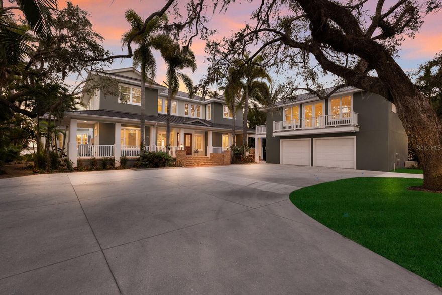 Elegant riverfront home with stunning views! This exquisite 4-bedroom, 4-1/2-bath custom-built residence, designed by Mark Sultana, offers an unmatched combination of luxury and comfort. Situated along the Manatee River, this property once served as the original landing for the Fogartyville/Palmetto Ferry and provides breathtaking water views from nearly every window. The grand entrance features a stunning custom circular staircase that sets the tone for the entire home, showcasing impeccable craftsmanship and attention to detail. The expansive living areas are highlighted by a full-height travertine fireplace, creating a striking focal point and an inviting atmosphere. Throughout the home, pecky cypress ceilings add unique character and warmth, while Brazilian cherry hardwood floors provide timeless elegance. Custom lighting enhances the elegant ambiance, further elevating the home’s refined interior. The thoughtfully designed layout boasts spacious bedrooms, luxurious bathrooms, and high-end finishes, ensuring both beauty and functionality in every corner. The spacious primary suite is a serene retreat with French doors leading to a private balcony with stunning river views, an oversized walk-in closet with custom built-ins to maximize storage and organization and a luxurious ensuite bathroom clad in polished travertine tiles and thoughtful high-end finishes. Guests will enjoy their own personal space in the garage apartment complete with private entrance, a fully appointed kitchen and a tiled bathroom. All windows and doors were replaced in 2023 with PGT hurricane-impact rated panels, ensuring protection during stormy weather without sacrificing style or natural light. The property also boasts two convenient laundry rooms and solar panels for enhanced energy efficiency while lowering monthly utility bills. Outside, mature landscaping surrounds the property, providing privacy and tranquility. A circular driveway welcomes guests and the front and rear porches are adorned with the timeless charm of Chicago bricks – all adding to the home's stately presence. Whether enjoying the serene river views (you have direct access to the Gulf with no bridges) or entertaining in style, this stunning residence is a true sanctuary for those seeking an extraordinary lifestyle. Enjoy a day at the world-renowned, sugar-sand beaches of Anna Maria Island and all the local island amenities, or take in the many restaurants, shops, museums and culture of nearby Downtown Bradenton – if that isn’t enough Sarasota and Tampa/St Pete are a quick trip away!