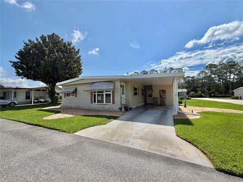 Photo of 146 Hibiscus Way, Leesburg, FL 34748 (MLS # G5114182)