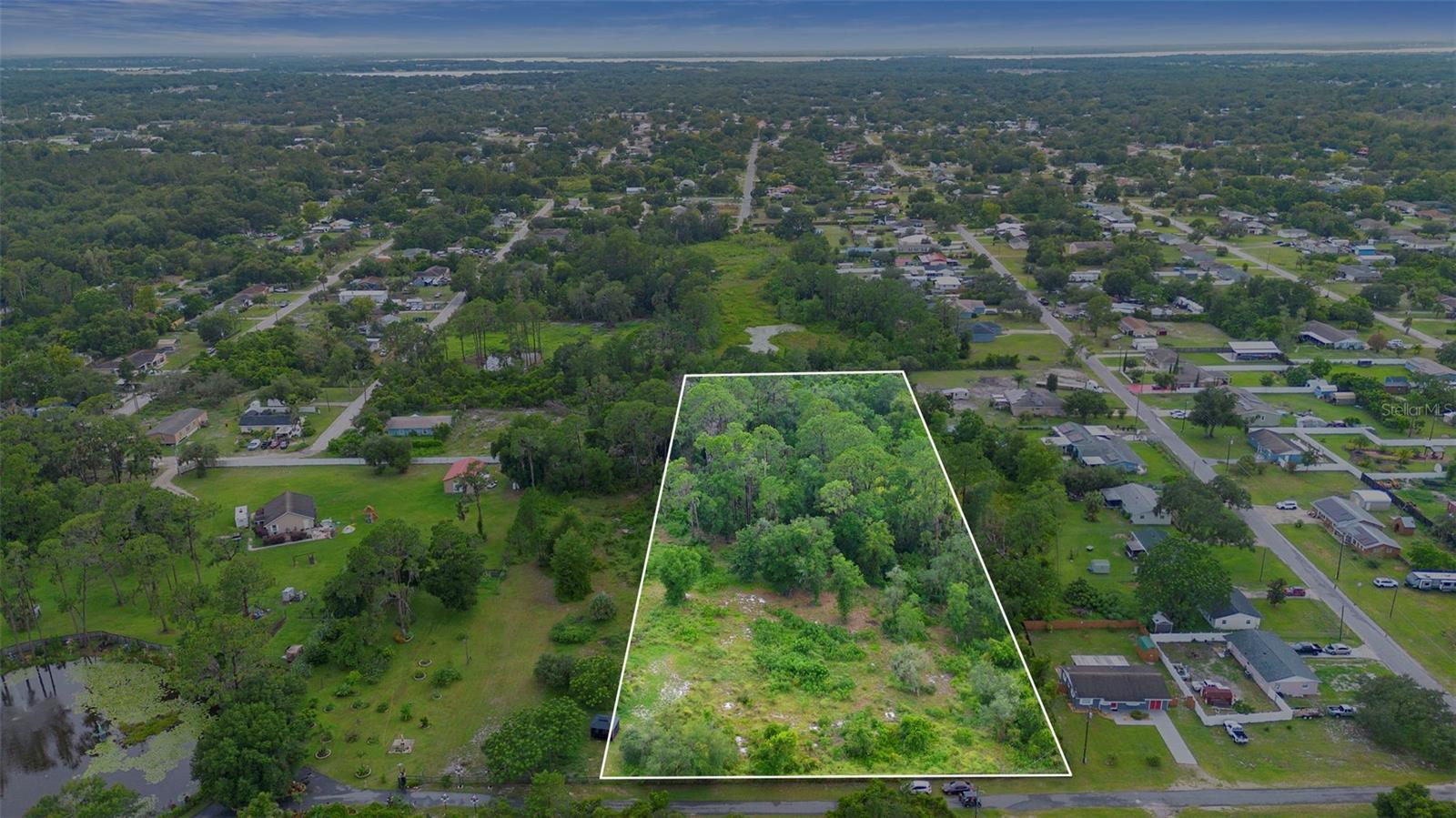 Over 3 Acres of Possibility – Prime Location!
Opportunity awaits on this gorgeous 3.08-acre (200 ft x 700 ft) parcel nestled in a quiet, well-established neighborhood. With mature trees offering shade and privacy, this property is the perfect canvas to build your dream home, place a manufactured home, or even create a private getaway surrounded by nature.
Enjoy the freedom of no HOA and plenty of space for outbuildings, recreational vehicles, gardens, or a custom-designed residence. The lot is high and dry, and while it will require a well and septic tank, utilities are nearby for a smooth build process.
Location is everything, and this property has it all—conveniently close to Lake Square Mall, Eustis, Tavares, Leesburg, The Villages, and the historic town of Mount Dora. You’ll love the nearby access to public transportation and all the shopping, dining, and entertainment these communities have to offer.
Outdoor enthusiasts will appreciate the nearby lake access. Whether you’re looking to build now or invest in land for the future, this one checks all the boxes. Don’t miss your chance to own over 3 acres in a desirable and growing area!