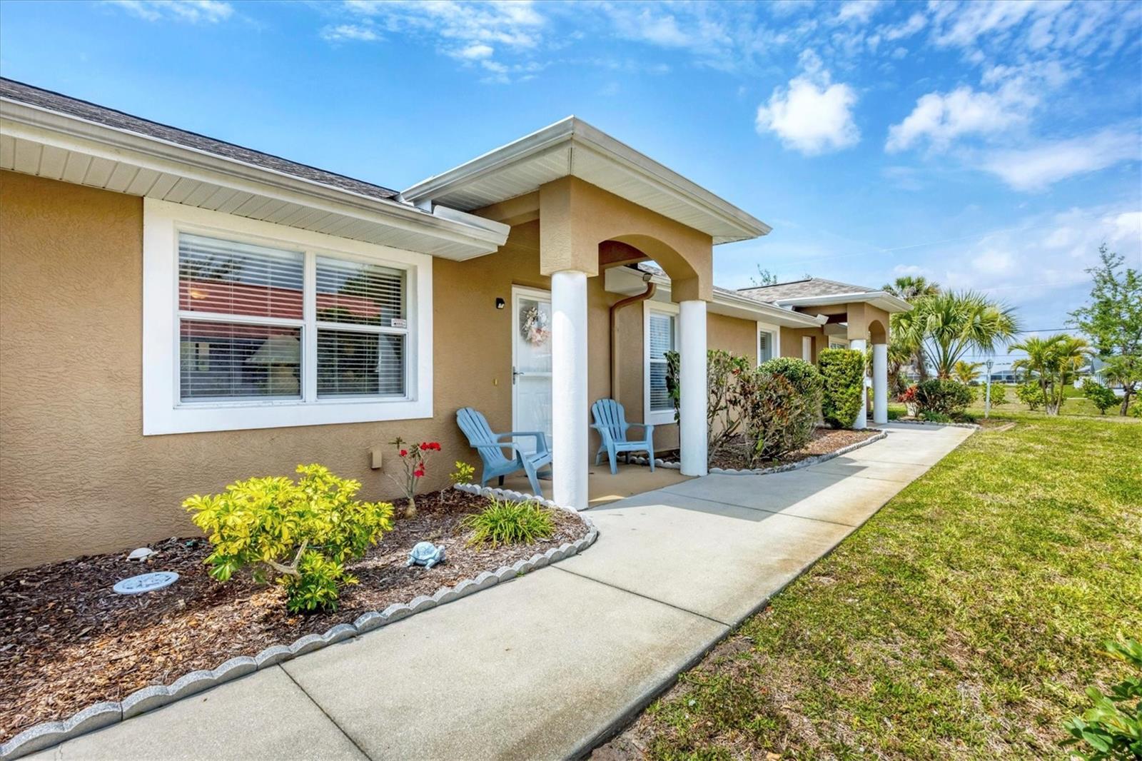 Adorable and convenient 2-bedroom & 2-bathroom CONDO with a GARAGE! Located in the popular neighborhood of Rotonda West, surrounded by golf courses and just 15 minutes to the BEACH! This condo is one of three in the building. It has high ceilings in the main living area and 1158 sf of air-conditioned living space. The great room is roomy with a pull-out sofa, and kitchen offers plenty of storage options with pantry closet and extra cabinets along the breakfast bar. It even has barely used, practically brand new appliances; purchase in January 2024! Step through the sliding glass doors to the comfortable air-conditioned Florida room with a wall of windows and access to the back yard. Your large laundry closet is there with washer/dryer, water heater and shelves for storage. The bedrooms are on one side of the home; the large primary is ensuite with a private bathroom and step-in closet. The home even has an upgraded mana block water system; each plumbing fixture has its own line which allows for easy shutoff access. The reasonable monthly association fee covers building and flood insurances. Master insurance covers the roof which is also brand new. AND, owners are allowed to have 2 domestic pets (under 40 lbs each please)! Clean your home with ease with the central vacuum system. The 12’ x 21.5’ GARAGE is a huge bonus also! No leaving your car out in the hot sun. This adorable home will not last long. The home is being offered TURN-KEY furnished so roll your suitcase in and make yourself right at home! Call to see it today!