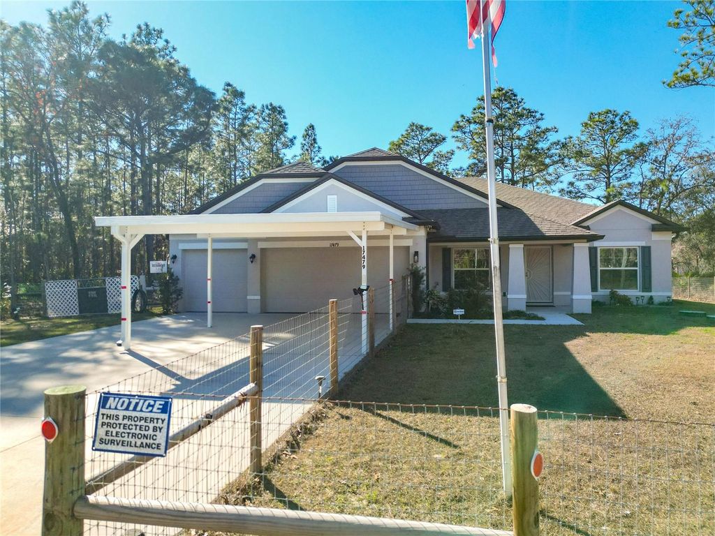 Photo of 17479 Macassar Road, Weeki Wachee, FL 34614 (MLS # TB8465815)