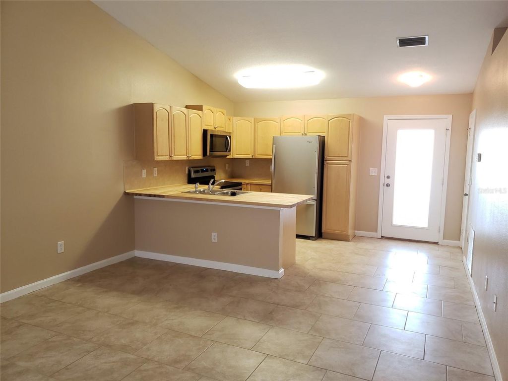 Photo of 32 Zoeller Ct #B, Palm Coast, FL 32164 (MLS # FC317161)