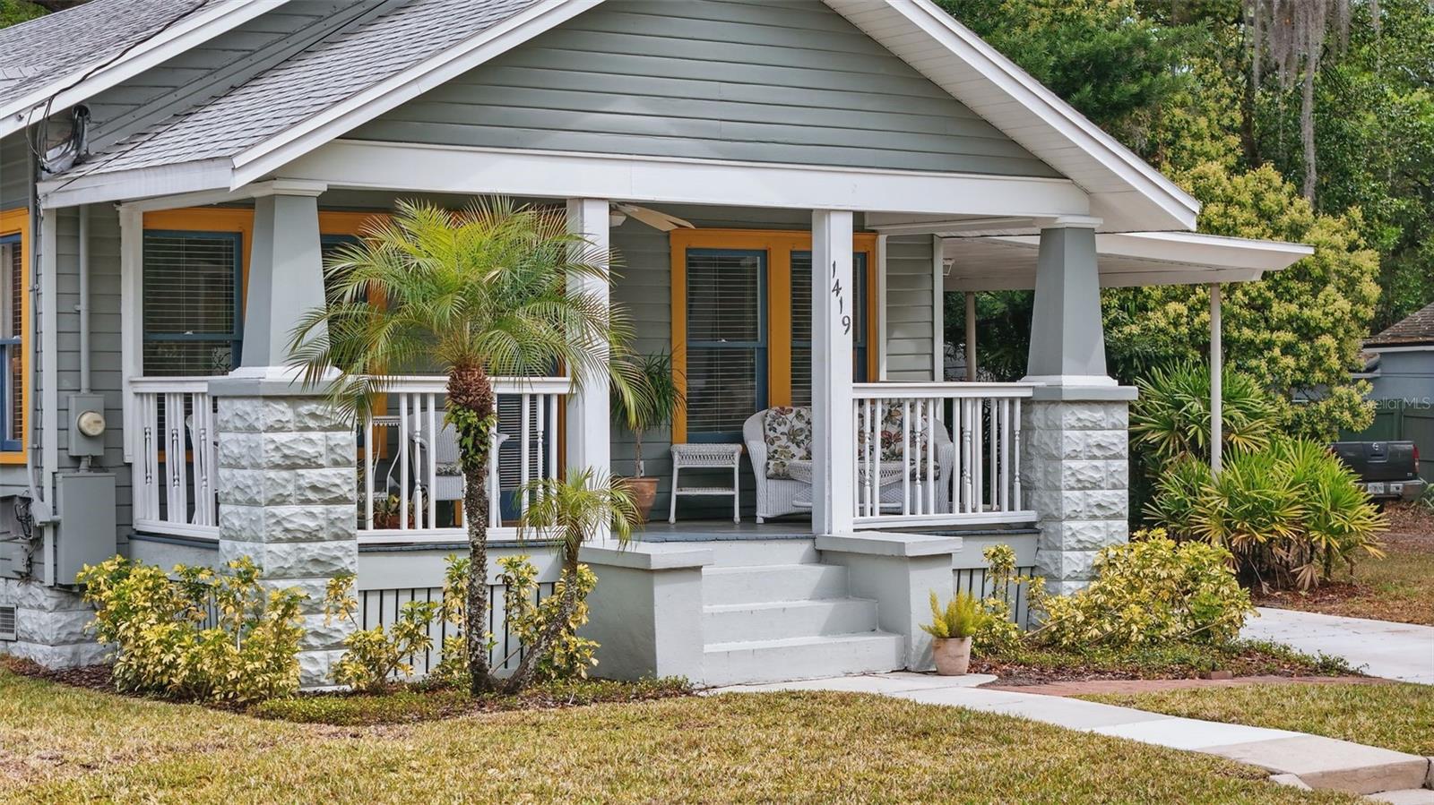 Welcome to this charming move in ready 1924 downtown Bungalow- located in one of Orlando’s most desirable neighborhoods - Colonialtown South. This gorgeous, fully renovated historic home combines timeless charm with modern conveniences and beautiful upgrades, both inside and out. This stunning home, just one block from Maxine on Shine, is sure to leave a lasting impression! As you arrive, the home's curb appeal immediately catches your eye, complemented by an oversized front porch—an inviting spot to enjoy your morning coffee. As you step through the front door, you are welcomed into a living room, featuring refinished heart of pine wood flooring, a cozy wood-burning fireplace, and an abundance of natural light. Head to the spacious dining room, where timeless elegance meets historic charm. This open concept floor plan is perfect for hosting unforgettable gatherings. The brand new kitchen features beautiful quartz countertops, custom tile walls from floor to ceiling, custom lighting on shelves, solid wood white shaker cabinets, a stunning vent hood and an amazing butler pantry to complete this showstopper kitchen. After preparing your meal, step out on your brick courtyard patio, an ideal space for relaxed dining, while enjoying picturesque views of the beautifully landscaped backyard. Your expansive, private and fenced backyard includes mature landscaping and a perfect size for your furry friends or adding a detached home for additional income. It’s the perfect place to unwind before heading out for a night on the town to many of the entertainment venues within walking distance. As the evening winds down, retreat to your primary suite, featuring a spacious, brand new custom ensuite bath with a ton of storage, glass enclosed shower and timeless charm. You will find the second bedroom bedroom and a beautifully upgraded full bathroom located in the hallway. Other features of the home include a NEW roof (2021), fresh interior and exterior paint, Repaired original flooring (with 100 yr-old heart pine) and refinished all floors, a new gas tankless water heater, new irrigation and smart keypad control, new wood on front porch, new driveway poured, restored/repaired 1924 windows. You’re located just one block from Maxine on Shine, the YMCA, the Milk District, Downtown Orlando and Thornton Park. Experience the downtown lifestyle in this incredible home! Call for your showing today!