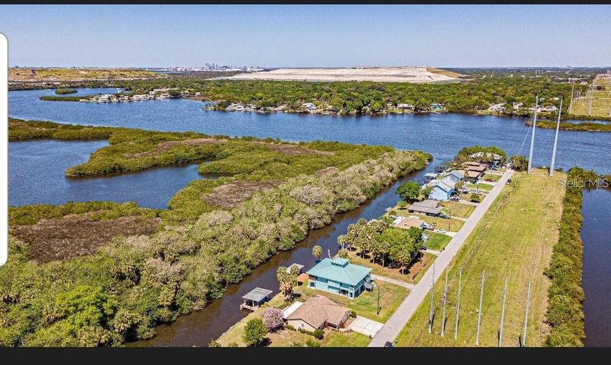 Come build your dream house on this beautiful land with 75 feet of waterfront property! Just around the corner to the Movie Theater, shopping and interstate. A short drive to Tampa Bay!