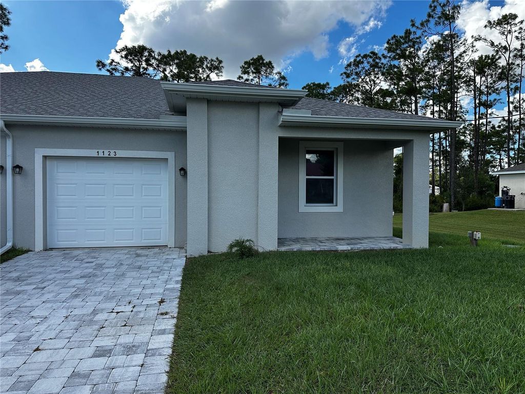 Photo of 1123 Albany Avenue, Lehigh Acres, FL 33971 (MLS # TB8441089)