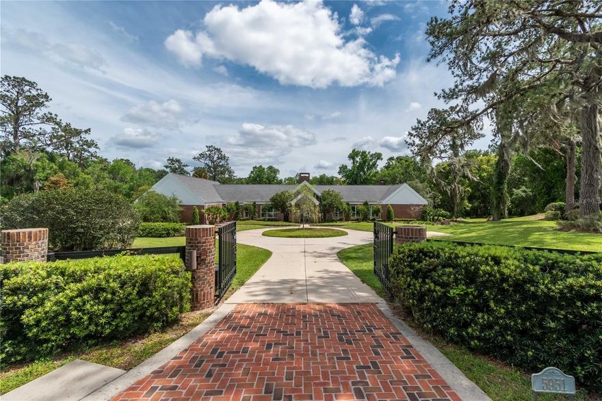 Within the peaceful, gated community of Summit II, this elegant estate overlooks just over 3.5 acres of
Central Florida bliss! The home is an immediate eye-catcher with mature landscaping, a circular driveway,
an attached 3-car side entry garage, and a park-like setting. Fully customized, the home offers a total of 3-
bedrooms and 4-baths with nearly 6,000 sq.ft. of space. The interiors showcase abundant natural light,
soaring cathedral ceilings, and stunning views of the outdoors throughout the home thanks to huge picture
windows that allow the greenery outside of the home to become a feature inside. The formal living area is
nicely open, with huge windows and french doors that open to the outdoors and a large brick-facade
fireplace. Filled with decorative accents, the kitchen is well-appointed and includes a large breakfast bar,
adjacent breakfast are with a view to the pool area, and additional pantry. There are many memorable
features and spaces throughout including a large professional office, formal dining area, a rock-garden, a
huge entertainment space with built-in wet bar and pool table, and built-in sound system. All bedrooms are
well appointed, but the master suite is particularly notable with an extra-large layout, a floor-to-ceiling
fireplace, private garden tub, huge walk-in closet, and private en-suite with dual sinks, ample counter space,
built-in vanity, and walk-in shower. To the back of the home is a true Florida oasis that features a sparkling
in-ground saltwater pool and spa, an expansive concrete pool deck, multiple brick patios with ample space
for entertaining, and a large covered area with built-in grill. This unique property is wonderfully maintained
and beautifully partially furnished if desired, making move-in a breeze. The community is highly convenient
to a variety of shopping, dining, entertainment, and medical options available just a short drive away. Rent
includes grounds care and pool maintenance. Pets are allowed with $500 pet deposit. Lease available from
8-12 months. Application fee, first, last, and security deposit required prior to move-in. No smoking.
Available partially furnished or un-furnished.
