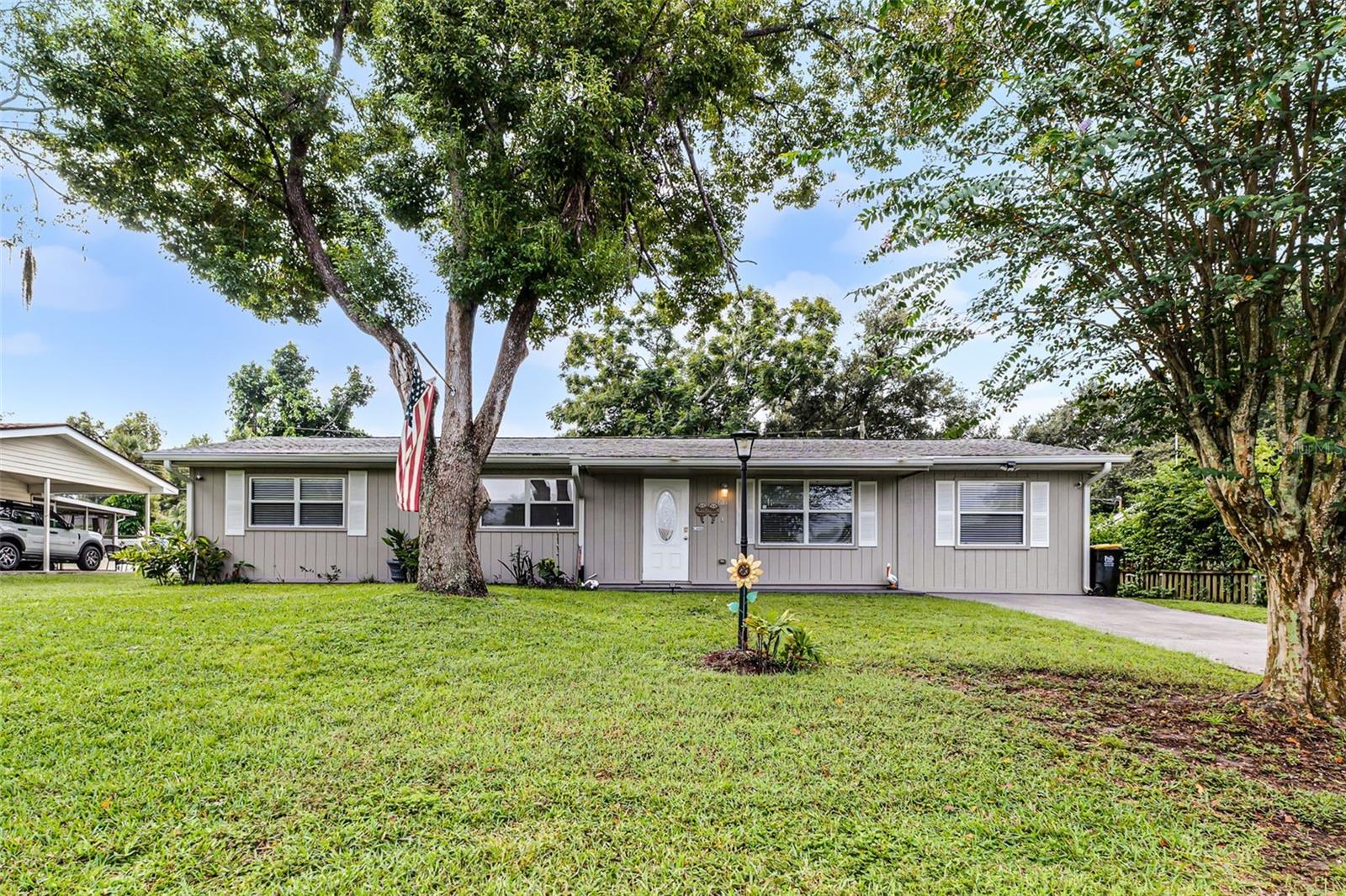 Welcome to this charming 4-bedroom, 1 bath home nestled in a quiet South Lakeland community. Ideally situated in the heart of Central Florida, this home offers convenience with just a short drive to both Orlando and Tampa, while also being minutes from popular shopping, dining, and everyday amenities. The home has been thoughtfully updated with a new roof (2021), new lanai roof still under warranty, new AC (2021) serviced regularly, new exterior paint (2022), new range (2019), and new dishwasher (2020). Washer and dryer convey with the sale. Inside, the layout includes a versatile 4th bedroom that doubles as a second living space, offering closet storage and French door for privacy-perfect for a bedroom, office, or bonus room. Step outside the French doors at the back to a spacious 12x17 screened lanai, ideal for relaxing or entertaining. The large yard is fully fenced with gate access and includes a 10x10 utility shed with electric, providing excellent storage or workspace options. With it's updated, flexible floor plan, and prime South Lakeland location, this home is a wonderful find for buyer's seeking comfort and convenience with easy access to all that Central Florida has to offer.