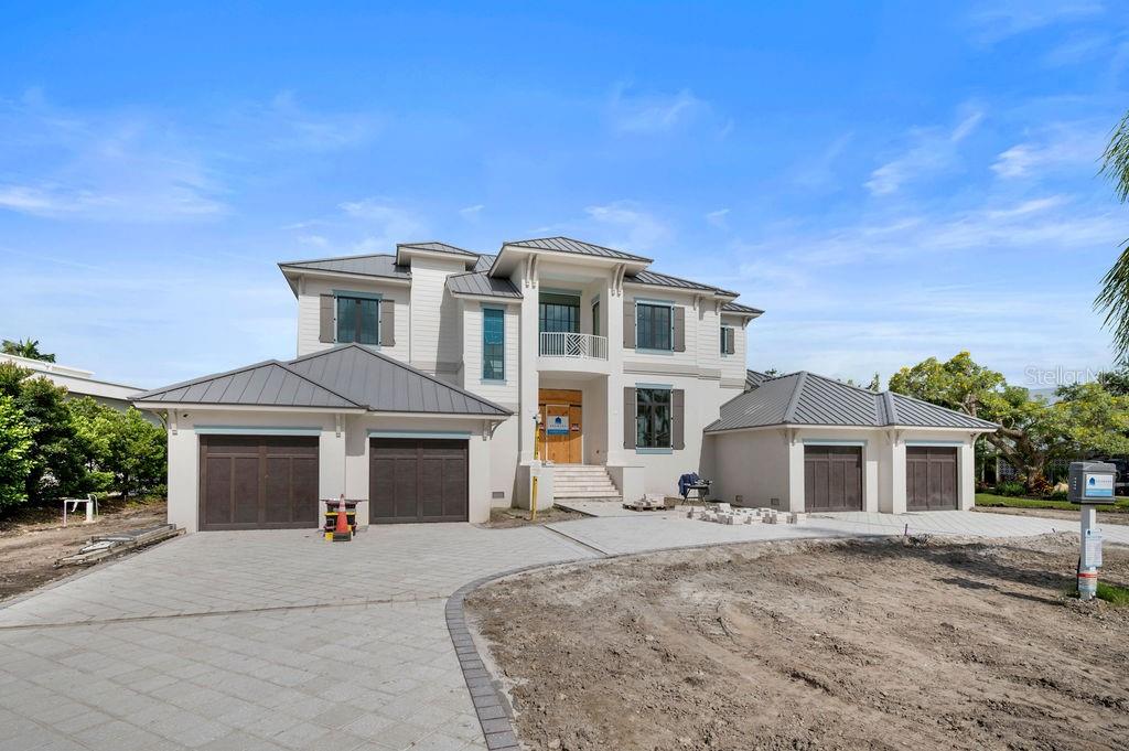Under Construction. Only a few weeks from completion, come and experience the epitome of luxury! Nestled on a quiet cul-de-sac west of Orange Avenue, this Florida Coastal masterpiece by Seaward Homes offers 5300 sq. ft. of prime waterfront living. With a bayou stretching almost 400 feet wide, enjoy direct access to the breathtaking Sarasota Bay and BIG WATER VIEWS that define coastal elegance.
Designed with meticulous attention to detail, the home features an expansive, light-filled open floor plan. It includes five spacious bedrooms, each with its own walk-in closet, five full baths, and two half baths. Two oversized lanais and a four-car garage ensure seamless indoor-outdoor living, while a third-level rooftop terrace provides panoramic views of Sarasota Bay.
Quality and craftsmanship are paramount in this Seaward Curated Collection home. Constructed with concrete block on both the first and second floors, ensures superior structural integrity. Inside, custom solid wood cabinets, crafted locally and available in a variety of colors and finishes, complement the kitchen’s luxurious Quartzite surfaces, including a custom island and backsplash. The professional-grade Thermador appliance package features a 30" refrigerator, 24" freezer columns, a gas cooktop, double ovens, and two dishwashers—perfect for culinary enthusiasts.
Every detail has been carefully considered, from Kohler plumbing fixtures and one-piece comfort height toilets to flooring options that include large format designer porcelain tile or European hardwood. The interior trim package includes eight-foot solid doors, oversized baseboards and casings, coffered ceilings, and substantial crown molding, with ceiling heights reaching up to 12 feet in select areas.
Additional highlights include a state-of-the-art electrical and lighting control system, a high-efficiency multi-zone air conditioning system, hurricane impact-rated insulated glass, and 10-foot sliding glass doors throughout. The architectural elegance of the home is further enhanced by a standing-seam metal roof, combining style and durability.
Outdoors, the expansive 45-foot wide lanai, complete with an outdoor kitchen, is perfect for entertaining, while the 40-foot inground heated pool and spa, designed by Borden Landscape Architects, offers a private retreat. The exterior is complemented by a semi-circular driveway with concrete shell pavers and an irrigation well.
Located at San Remo Terrace, this luxurious property is just minutes from Siesta Key Beach, Morton’s Market in Southside Village, Downtown Sarasota, and Sarasota Memorial Hospital, making it the ideal home for those seeking the ultimate Florida lifestyle.