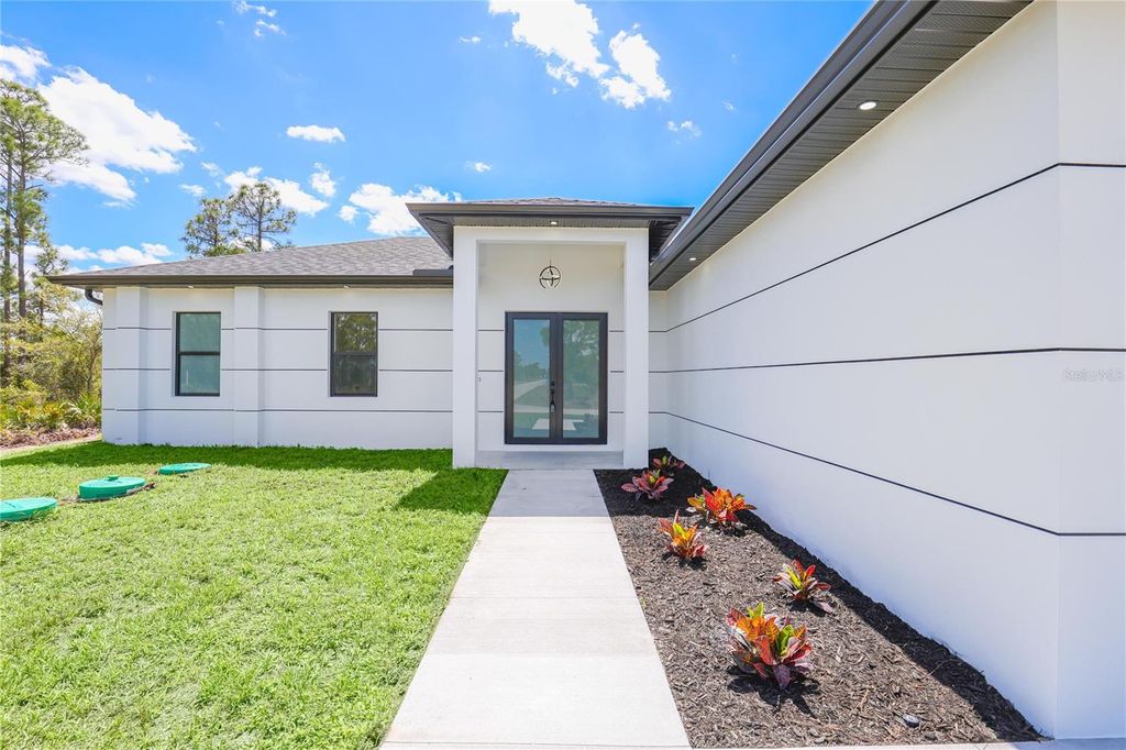 Photo of 1124 S Edelweiss Street E, Lehigh Acres, FL 33974 (MLS # C7524554)