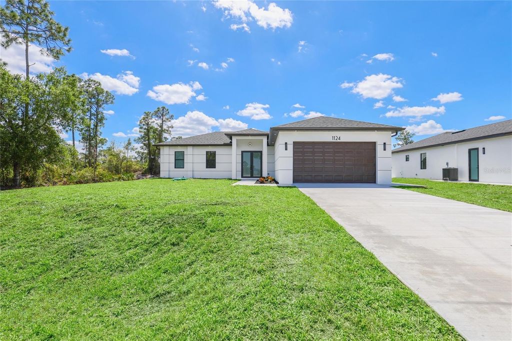 Photo of 1124 S Edelweiss Street E, Lehigh Acres, FL 33974 (MLS # C7524554)