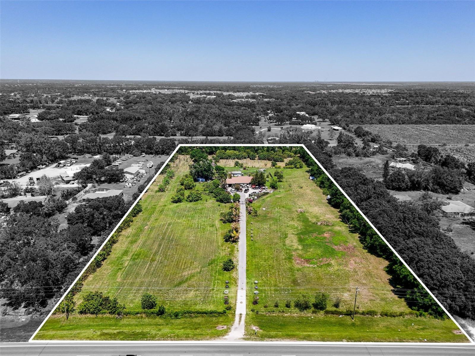 Don’t miss out on this prime development opportunity! Now available are 6.9 acres in the heart of the Lakewood Ranch Expansion. This agriculturally zoned property presents an exceptional opportunity for residential or commercial development, ideally situated in one of the most rapidly expanding areas on Florida’s Gulf Coast. Located just over 6 miles from the SR 64 exit off I-75 and less than a quarter mile west of the Uihlein Road and SR 64 intersection, this property is directly in the path of Lakewood Ranch’s newest growth corridor. The parcel is entirely within Flood Zone X, making it high and dry—an increasingly rare find in this area. Included on the property is a 3-bedroom, 2-bath single-family home that could serve as a primary residence, rental, or interim use while planning future development. The roof on the home was replaced in 2022. Uihlein Road serves as a main access route into the latest residential expansions of Lakewood Ranch, offering direct connectivity to thriving new communities such as Esplanade at Azario, Star Farms, Cresswind, Sweetwater, Lorraine Lakes, and Lakewood National Golf Club. Just west of several new construction neighborhoods including Marisol, Palm Grove, and the luxury Alton Lakewood apartments, this location is surrounded by both current and planned development activity. In addition to residential growth, the area is slated for new commercial hubs, including a Publix shopping center and other retail destinations that will further enhance the area's desirability and accessibility. With its unbeatable location, development-friendly conditions, and placement at the center of a high-demand growth area, this property offers significant long-term potential for rezoning opportunities and will interest investors, developers, or those seeking a strategic opportunity in East Manatee County.