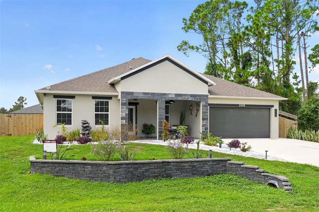 Photo of 2595 Hagoplan Lane, North Port, FL 34288 (MLS # O6427295)