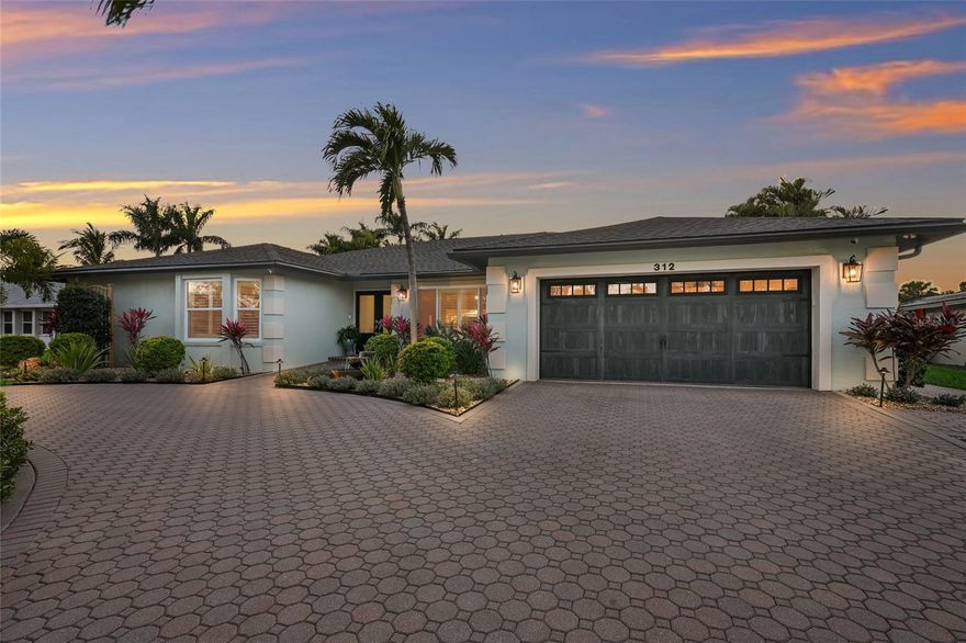 ABSOLUTELY STUNNING 4 BEDROOM WATERFRONT POOL HOME ON BELAIR BAYOU! Completely redone by Cahill Homes in 2024, this NW Bradenton residence has been renovated to exceptional standards and offers a level of quality rarely found at this price point. NOTHING LEFT TO DO BUT MOVE IN!!! NEW ROOF, IMPACT WINDOWS AND DOORS, NEW A/C & DUCTWORK, NEW PROFESSIONAL LANDSCAPING, NEW KICHEN, NEW BATHROOMS, NEW FLOORING, NEW TANKLESS WATER HEATER, RENOVATED POOL AND EQUIPMENT, NEW FENCING, NEW IRRIGATION, NEW STORAGE SHED, NEW BOAT LIFT MOTOR & CANOPY, AND THE LIST GOES ON AND ON!!! The home makes an immediate impression with its expansive circular paved driveway, framed by tropical landscaping and mature palms. A coastal inspired exterior, modern lighting, double door entry, and two car garage create impressive curb appeal. Positioned on an elevated bluff and not located in a flood zone, this property provides added protection and peace of mind. Inside, the open floor plan features vaulted ceilings, designer fans, recessed lighting, and nearly 3,000 square feet of living space, offering 4 bedrooms plus an office and 2 bathrooms. Walls of sliding glass doors connect the main living areas to the outdoor space, while custom built ins, plantation shutters, and tile flooring enhance the overall design. The kitchen is a true showpiece, highlighted by custom wood cabinetry with contrasting lower cabinets, oil-rubbed bronze hardware, and premium stainless steel appliances, including a french door oven and 6-burner Fulgor gas range with statement hood. Granite countertops, an oversized island with seating, workstation sink, herringbone backsplash, under cabinet lighting, glass-front display cabinetry, and a walk in pantry complete this well designed space for everyday living and entertaining. The primary suite offers a private retreat with tray ceilings, updated lighting, and ample space for a king sized bed and sitting area, along with convenient access to the office. The ensuite bath features dual vanities with granite countertops, custom cabinetry, designer fixtures, and a large walk in shower with glass enclosure. Two walk in closets provide abundant storage. On the opposite side of the home are two additional bedrooms and a fully renovated bathroom that also serves as a pool bath. The fourth bedroom is currently used as an office and can easily function as a bedroom with a closet already in place. The laundry room includes custom cabinetry, granite counters with an undermount sink, and a tile backsplash with under cabinet lighting. The backyard is a private tropical escape featuring a heated pool and elevated spa surrounded by paver decking, manicured landscaping, sail shades, string lighting, and multiple seating areas. The fully fenced yard offers generous green space and water views, along with a custom shed for storage. The property extends to a private 50+ foot dock with a covered boat lift on Belair Bayou, providing direct access to Warner’s Bayou, the Manatee River, and the Gulf—ideal for boating, fishing, and waterfront living! Warner’s West Bayou is one of Manatee County’s most desirable waterways, known for protected waters and high bridge clearance suitable for larger boats. Conveniently located minutes from the beaches of Anna Maria Island and a short drive to downtown St. Petersburg and Sarasota, with easy access to IMG Academy, St. Stephen’s Episcopal School, Bradenton Christian School, and Robinson Preserve. TRULY A RARE OPPORTUNITY!