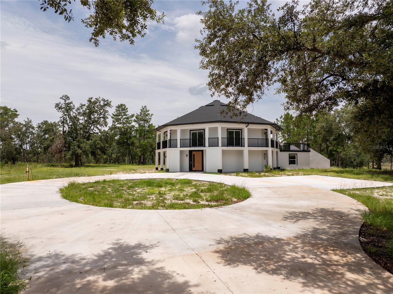 40 Private Acres | Scenic Lake | Luxury Renovated Estate | Wedding Venue Potential
Set on 40 private acres of high and dry buildable land with a scenic lake, this architecturally striking octagon estate offers an unmatched blend of luxury, space, and limitless potential. Fully renovated with the finest materials and finishes, the 3,600 sq ft residence features 5 spacious bedrooms, each with private balcony access, 2 full bathrooms, 2 half baths, and a breathtaking chef’s kitchen designed to impress.
The gourmet kitchen boasts top-of-the-line appliances, a built-in coffee machine, invisible oven integrated into the island, double wine coolers, and sleek custom cabinetry. Additional standout features include a dramatic pivot front door, centralized skylight, and thoughtful architectural details throughout.
Also on the property is a separate 3,200 sq ft warehouse, offering endless options, from an equestrian retreat or private compound to a luxury short-term rental or event venue. In fact, this location is ideal for a wedding venue, with a nearby property recently selling for nearly double due to its active venue status. A ready-to-go wedding venue project is also available if you’re interested in taking it to the next level.
Located directly on State Road 44, you’re just minutes from DeLand and Apopka, and within 40 minutes of both Disney and Orlando. Whether you’re envisioning a private sanctuary, a profitable investment, or a visionary business venture, this one-of-a-kind estate delivers.
Schedule your private showing today and explore the possibilities.