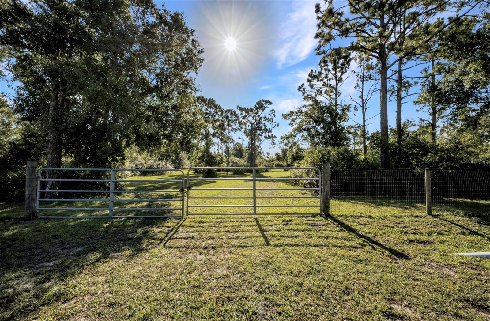 Country Charm Close to Everything – 2.5 Acres in Punta Gorda Acres
Discover the ideal combination of country charm and city convenience with this 2.5-acre cleared and fenced parcel in the highly sought-after Punta Gorda Acres community. Offering space, privacy, and flexibility, this property is a rare find—perfect for building your dream estate, hobby farm, or equestrian retreat. Yes, horses are welcome!
With no designated builder and no HOA restrictions, you have the freedom to design and build exactly what you envision. Situated on paved roads and located in Flood Zone X, this lot provides peace of mind and ease of access. The impressive 332 feet of frontage creates a striking entrance to your future property.
Best of all, you’re only minutes from historic downtown Punta Gorda, top-rated schools, shopping, dining, and major highways—keeping you close to everything while still enjoying the serenity of country living.
An excellent opportunity for your next chapter in sunny Southwest Florida.