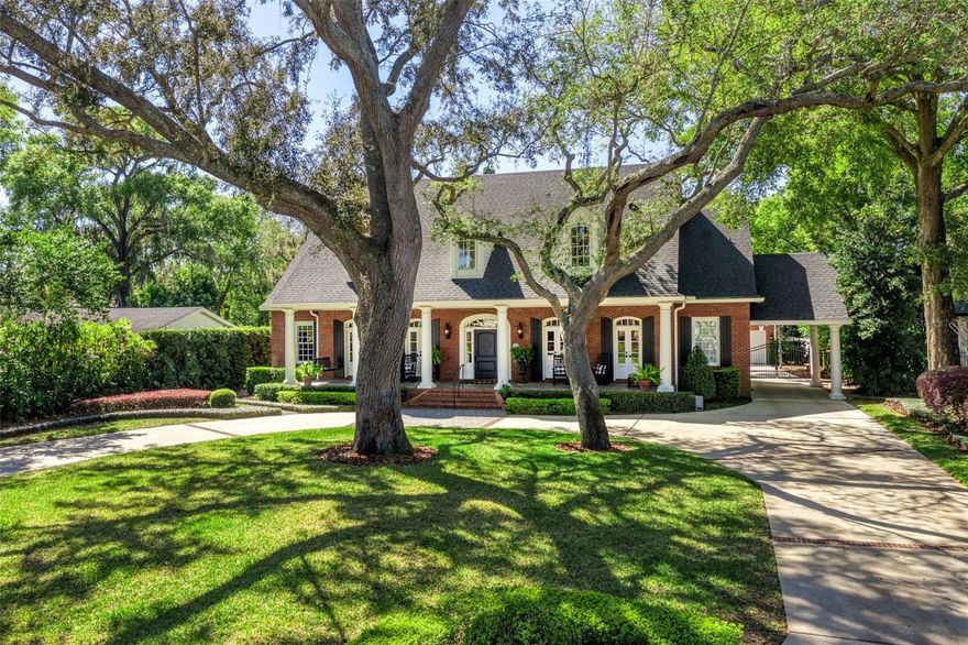 Set on a sprawling half-acre, surrounded by meticulously manicured landscaping, this custom-built traditional estate exemplifies refined luxury, modern convenience, and an unparalleled lifestyle.
The red brick façade, covered porches with glass doors, and gated side porte-cochere set a timeless tone, while two-story fluted columns add stately elegance. 
Inside, classic architectural details merge with modern design, highlighted by two-story coffered ceilings, intricate millwork, and expansive windows and French doors that flood the home with natural light.
Thoughtfully designed for both entertaining and everyday living, the gourmet kitchen includes a 6-burner Viking gas cooktop, double dishwashers and sinks, a paneled refrigerator and separate full-sized freezer, a walk-in pantry, and an oversized island with breakfast bar seating.
The first floor features a private primary retreat, two powder rooms, a workstation/mudroom accessible off the porte-cochere, and one of two laundry rooms.
Upstairs offers three spacious bedroom suites with walk-in closets, a versatile bonus room, and a second laundry room.
Embrace the Florida lifestyle from a two-story covered brick patio with a built-in gas grill, overlooking the private, fenced-in backyard oasis and breathtaking saltwater pool and heated spa, all elevated by a three-tier fountain and fire pit area, and wrapped in lush landscaping; this outdoor space is truly magical and not easily replicated in Winter Park!
A circular driveway provides ample parking, while a gated side drive leads to an oversized, detached three-car garage with a bonus room above—ideal for a gym or studio.
This particularly grand, wide street in the City of Winter Park is something truly special. Ideally located near Baldwin Park, Corrine Drive, and Park Avenue, and zoned for highly regarded Audubon K-8, this estate is more than a home—it’s a statement in timeless elegance. *Ask for a list of improvements, the floorplan and click on the virtual tour!