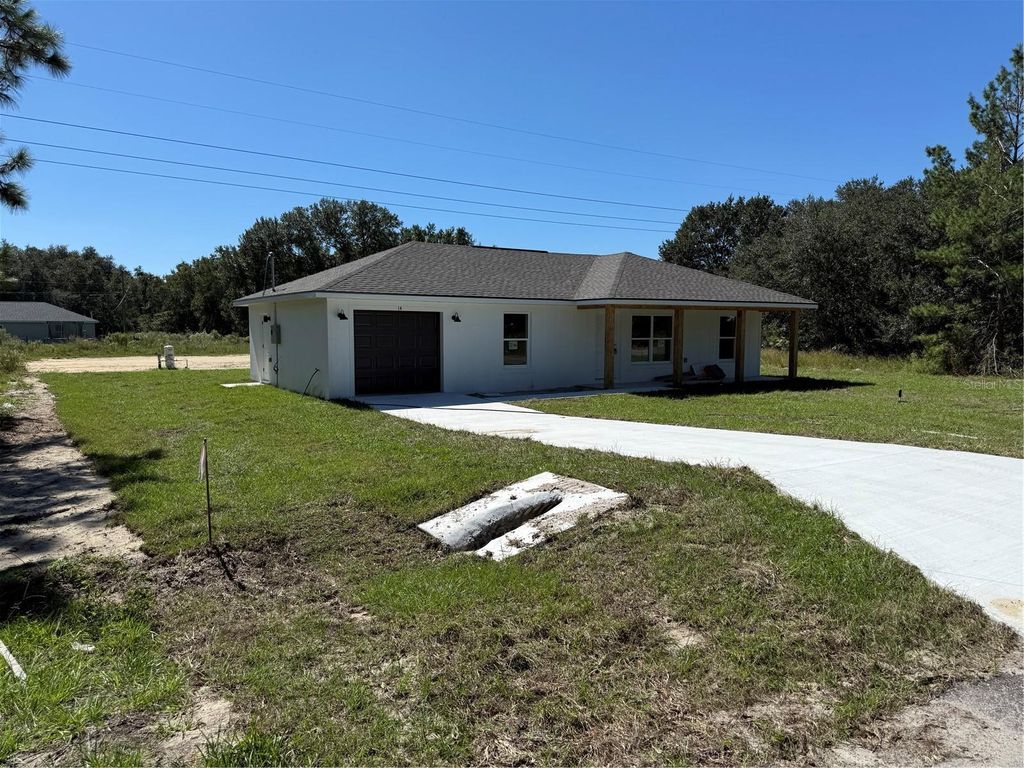 Photo of 14 Guva Trak, Ocklawaha, FL 32179 (MLS # OM711403)