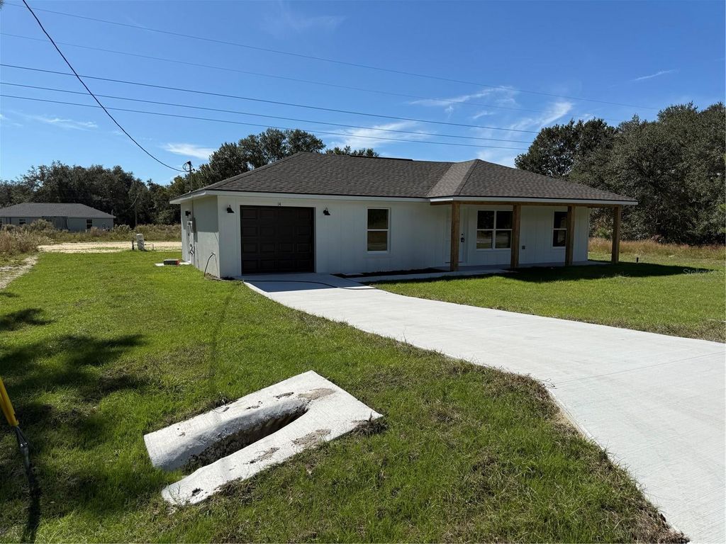 Photo of 14 Guava Trak, Ocklawaha, FL 32179 (MLS # OM711403)