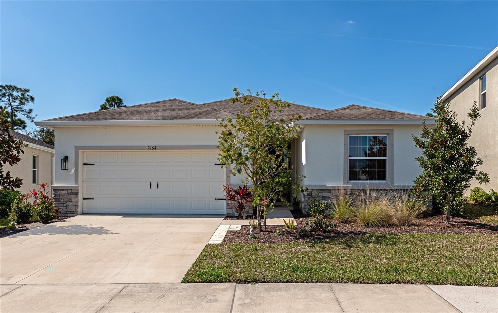 **THIS PROPERTY QUALIFIES FOR A 1% LENDER INCENTIVE IF USING PREFERRED LENDER. INQUIRE FOR MORE DETAILS.** Discover the perfect blend of comfort, style, and convenience in this beautiful Lantana model home, located in the highly desirable Bay Landings community. Offering 2,051 sq. ft. of thoughtfully designed living space, this 4-bedroom, 2.5-bathroom home is ideal for families, entertainers, and those who love the Florida lifestyle. Step inside to find a bright and open floor plan with elegant finishes throughout. The modern kitchen is a chef’s dream, featuring stainless steel appliances, granite countertops, a spacious island, and ample cabinet storage. The kitchen seamlessly flows into the dining and living areas, creating a perfect space for entertaining guests or enjoying cozy family nights. The primary suite is a true retreat, boasting a spa-like ensuite bathroom with dual vanities, a large walk-in shower, and an expansive walk-in closet. Three additional well-appointed bedrooms provide plenty of space for family, guests, or a home office. A convenient half-bath adds extra functionality to the home. Enjoy Florida’s beautiful weather year-round with a covered lanai and a generously sized backyard with plenty of room to add a pool, creating your own private oasis. Bay Landings is a vibrant community with resort-style amenities, including a sparkling community pool, clubhouse, fitness center, dog park, and scenic walking trails. Located just minutes from Waterside Place and University Town Center, you’ll have easy access to top-rated schools, shopping, dining, and entertainment options. Plus, you’re only a short drive from Florida’s world-famous Gulf Coast beaches! Don’t miss this incredible opportunity to own a beautiful home in one of Sarasota’s most sought-after communities. Schedule your private showing today!