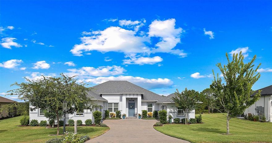 Welcome Home to this beautifully expanded Royal Palm in the Bella Vista section of Harbor Hills Country Club, a truly gated golf community in Lady Lake just minutes to The Villages.  Built in 2020, this home offers 2,466 square feet of thoughtfully designed living space and 3,526 total square feet, including a 2-car garage PLUS a expanded golf cart garage with an additional bonus storage room, and no major updates needed. Nestled on an oversized, elevated lot, the property offers panoramic golf course views and serene wooded privacy behind. The backyard is a true retreat, featuring a saltwater inground pool framed by a fully enclosed lanai, with both covered and open areas perfect for relaxing, entertaining, or simply soaking in the tranquil views.

Inside, luxury vinyl plank flooring stretches throughout the home in soft, neutral tones, enhancing the light-filled, open layout. Volume ceilings and modern, updated light fixtures add to the bright, airy atmosphere. 

The kitchen is the heart of the home, anchored by a generous 5x8 island with pull-outs, granite countertops, and soft-close cabinetry illuminated by both upper and lower lighting. A sleek glass black backsplash and built-in beverage refrigerator add style and convenience. 

Sliding doors from the kitchen open seamlessly to the lanai and pool area, bringing the outdoors in.  Pool was installed and professionally serviced by T&D Pools, a local pool company. 

The primary suite has been expanded for added comfort, featuring his-and-her closets, dual vanities, a soaking garden tub, and a separate shower, with an adjacent laundry room offering built-in cabinetry for additional storage. 

Guest bedroom 2  includes  a pocket door closure for privacy, ideal for guests, and the modern-styled guest bathroom is thoughtfully sized with an oversized vanity and step-in shower surrounded by seamless glass. 

The 2-car PLUS expanded golf cart garage is side-facing garage is finished with poly epoxy flooring, plenty of storage and includes a Nova whole-house water filtration and softener system.

Beyond the home, Harbor Hills Country Club offers an exceptional lifestyle with a championship golf courses, a recreation center for public and private gatherings , tennis, pickleball, and a variety of social and fitness amenities such as a private fully updated and equipped and includes a private sauna. This home combines elegant finishes, functional design, and a serene, active Florida lifestyle, creating the perfect setting for both everyday living and entertaining.