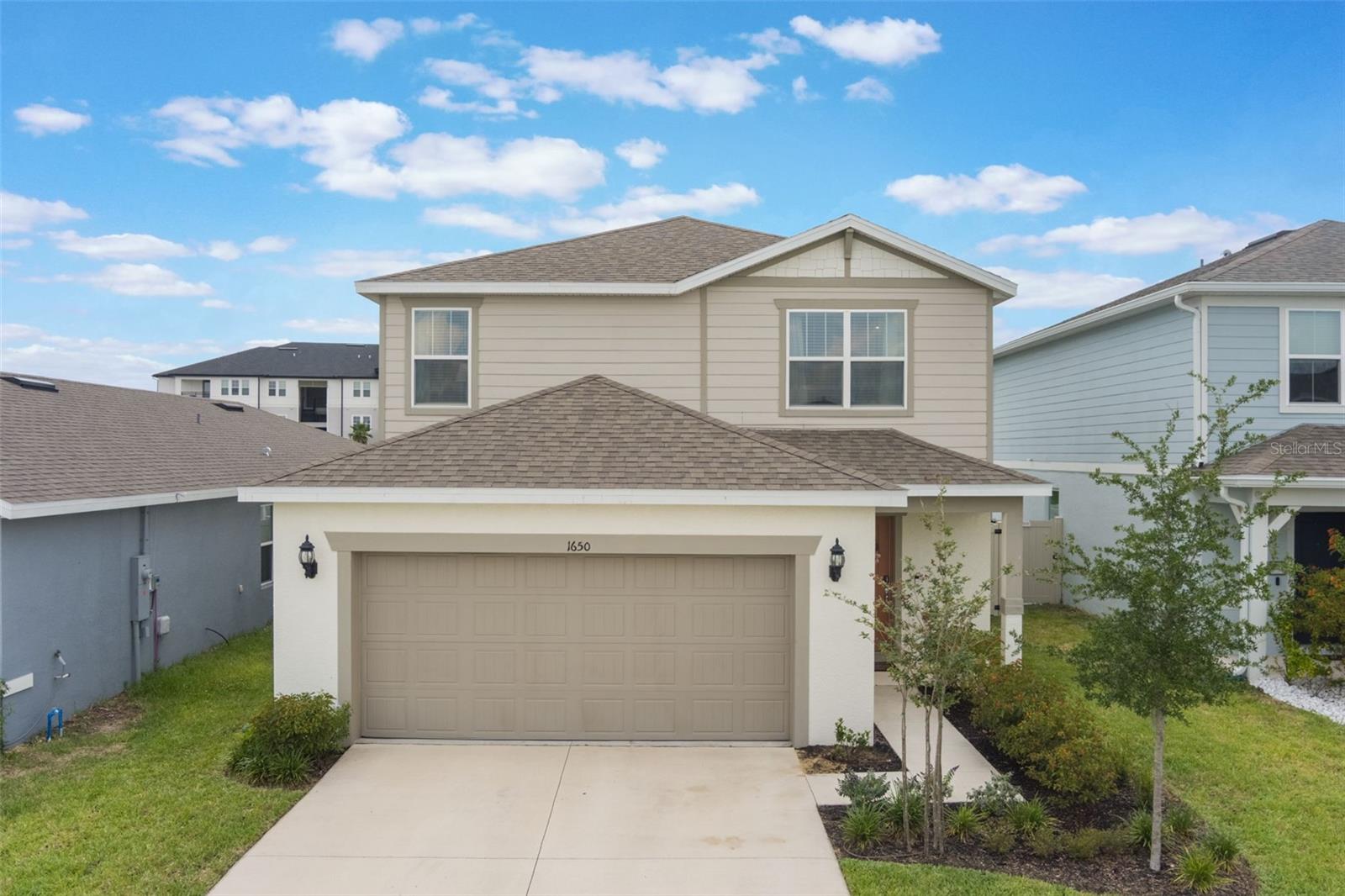 Welcome to 1650 Delightful Drive, a beautifully upgraded 4-bedroom, 3-bathroom home in a convenient spot of Davenport, offering over 2,200 square feet of thoughtfully designed living space. This spacious and light-filled home features an open-concept layout with a stylish living area that includes a custom-built beverage center complete with floating shelves and a mini refrigerator, creating the perfect space for entertaining or relaxing. The modern kitchen features updated hardware, stainless steel appliances, a large center island, adjacent dining area and elegant pendant lighting, making it both functional and visually appealing. On the main floor, you’ll find a versatile bedroom outfitted with a custom built-in desk, ideal for working from home or hosting guests. Upstairs, a generous bonus loft provides additional living space that can be used as a media room, playroom, or second lounge area. The oversized primary suite is a true retreat, featuring a spacious layout and a walk-in closet with a custom organization system. Additional highlights include new ceiling fans throughout, tasteful finishes, and ample storage. The rear of the fully fenced-in home faces West so you can enjoy nightly sunsets on your covered lanai. Situated in a quiet, well-maintained neighborhood, this home offers a comfortable and stylish lifestyle just minutes from shopping, dining, schools, major highways and just 20 minutes away from the theme parks. With its blend of functionality, comfort, and thoughtful upgrades, this home is move-in ready and waiting to be enjoyed. Walking distance from Ridgeview Global Studies K-12 school.