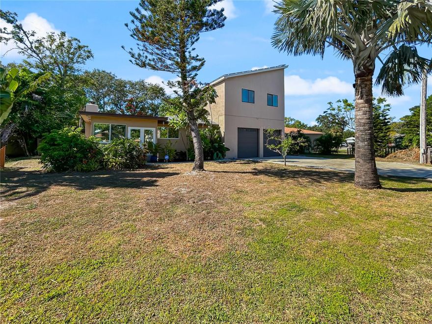 This one-of-a-kind residence on a large, fully fenced lot offers the best of Tampa living, combining close-in convenience with designer upgrades throughout. Located just minutes from the scenic Bayshore Boulevard, Downtown Tampa, Ballast Point, Hyde Park, Davis Islands and MacDill AFB, you’re also a short drive from Bay-to-Bay, S. Dale Mabry Ave and Gandy Blvd, so commuting, errands and recreation are all within easy reach.

Step inside to discover an open concept great room where the living room, dining area and kitchen flow seamlessly. The natural light pours in and highlights a striking stone fireplace, elegant granite countertops, induction cook-top and stainless steel appliances in the kitchen, and abundant solid-wood cabinetry for a warm, upscale feel. The sun-filled backyard sunroom with built-in spa and ceiling fans is a perfect spot for relaxing or entertaining family and friends in comfort.

Downstairs you’ll find the refinished oak hardwood flooring (2022), generously sized bedrooms with ample closet space. The second-floor addition, which was completed in 2016 and over 800 sq ft. It features its own dedicated HVAC system and was designed with durability and safety in mind: major electrical systems are elevated off the ground, and the stairs rise 20+ feet above sea level, giving you peace of mind during storm events.

The primary suite is elegantly appointed with teak hardwood floors, remote-controlled curtains, a spacious walk-in closet, and a spa-style bathroom featuring twin sinks with stone countertops, walk-in shower and a soaking tub with a heated backrest. For the car enthusiast and storage-minded homeowner, the oversized garage includes additional storage or workspace.

Energy efficiency meets modern tech with a fully paid-off 11 kW PV solar array system (grid-tied with TECO), which remained unaffected by the recent hurricanes and brings significantly lower monthly electric bills. The home also features impact rated windows throughout for added security and resilience.

This home checks so many boxes: location, style, durability, upgrades, and value. Come and see for yourself everything this exceptional property has to show.