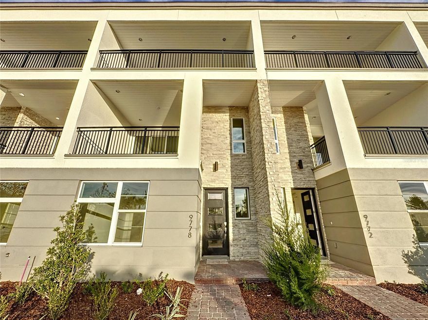 Calling all investors and discerning buyers—tenants in place! Welcome to this exceptional three-story townhome offering maintenance-free, country club living in the heart of Eagle Creek, one of Lake Nona’s most sought-after gated communities. This elegant 3-bedroom, 2.5-bath residence with a two-car garage showcases breathtaking views, two expansive balconies, and a thoughtfully designed layout ideal for seamless indoor and outdoor living. The first floor features a private primary suite highlighted by a tray ceiling, spacious walk-in closet, and a beautifully appointed ensuite bath with dual sinks, solid-surface countertops, and an oversized semi-frameless walk-in shower. Designed for entertaining, the second level boasts soaring 10-foot ceilings and a stunning gourmet kitchen that serves as the heart of the home. An oversized quartz island, 42” premium cabinetry, stainless steel appliances, custom backsplash, and designer lighting create a true showpiece. The open dining and family room are filled with natural light and open to a screened-in paver patio through double sliders—perfect for enjoying Florida’s lifestyle. An additional large balcony provides a tranquil space to relax and take in picturesque sunset views. The third floor offers two generously sized secondary bedrooms and a versatile loft with access to a scenic view deck, delivering yet another inviting outdoor retreat. Residents enjoy an unparalleled lifestyle with access to resort-style amenities including a championship golf course and clubhouse, fitness center, family recreation facilities, resort-style pool and children’s pool, tennis and basketball courts, playground, and multi-purpose sports fields. Ideally located near Medical City, Lake Nona Town Center, top hospitals, dining, shopping, major highways, and Orlando International Airport, with Central Florida attractions and beaches just a short drive away. Top-rated schools and upscale conveniences make this community ideal for professionals, families, and investors alike. The HOA covers exterior maintenance, including roof, building insurance, landscaping, and pest control—offering truly carefree living. Don’t miss this opportunity to own a remarkable home in a premier Lake Nona community. Schedule your private showing today.