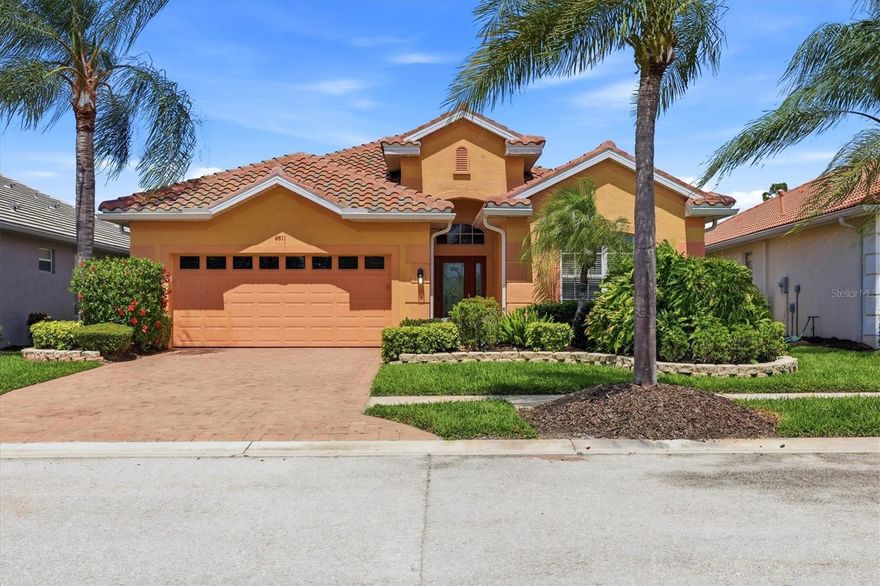 Tucked along the 1st hole of the Creek Course in Heron Creek Golf & CC, this cheerful Mediterranean-inspired home boasts 2,174 square feet of easy living, featuring 3 BED, 2.5 BA, DEN and POOL & SPA, all with a personality uniquely its own. You can't help but smile when you arrive as it welcomes you with warm tangerine and peach tones, a multicolored barrel tile roof, and a paver drive setting a lighthearted tone from Hello! Inside, volume ceilings, tray details, and an airy flow guide you from the foyer into comfortable gathering spaces designed for both everyday living and effortless entertaining, while a fun interior palette with citrusy pops of tangerine and lime brings a fresh, uplifting energy—light, bright, and just a little reminiscent of rainbow sherbet on a warm Florida afternoon. The UPDATED KITCHEN blends beauty with function, featuring raised-panel light wood cabinetry, exotic granite countertops, sleek slate-finish stainless appliances, a large corner pantry, and deep pull-out pot drawers, all accented by a mosaic tile backsplash that adds texture and visual interest. A flexible den offers the perfect spot for a home office or quiet retreat, while the split bedroom design creates privacy for guests, with two bedrooms tucked into their own wing with a shared bath, plus a convenient powder room for visitors. The primary suite is a relaxing escape where classic plantation shutters filter in soft natural light and capture that easy, coastal-breeze feeling, complete with an extraordinarily spacious walk-in closet and private bath. Outdoors is where this home truly shines and your personal oasis awaits—your freshly resurfaced, solar-heated pool and spa invite year-round enjoyment, all set within a screened paver lanai overlooking the fairway and a peaceful natural backdrop, where osprey, bald eagles, and blue heron are known to gather and vibrant sunsets paint the evening sky. Additional highlights include a designated laundry room, two-car garage, and a whole-house Generac generator for peace of mind, along with the added benefit of a NEW BARREL TILE ROOF. Most furnishings are available under separate contract, offering an easy move-in ready option if desired, all just a short golf cart ride to the clubhouse and the exceptional lifestyle Heron Creek is known for. Heron Creek offers exceptional amenities including a 21,000 sq ft clubhouse, 27 holes of Championship golf Arthur Hills design, resort style pool & spa, a robust social activity calendar, fitness center, Tennis courts & formal & casual dining options! Club Membership is required with 3 membership levels offered beginning at $276/month *NO CDD FEES * LOW HOA FEES include lawn care, trimmings, mulching, irrigation, FIBER OPTIC/ TV/ HIGH-SPEED INTERNET & Gated entry, conveniently located w/easy access to I-75 & US-41, Cocoa Plum Shopping, Myakkahatchee Creek trails, WELLEN PARK, Braves Stadium, COSTCO & will be just 3 miles to the new 507 Million SMH Hospital now under construction to I-75 and Sumter Blvd!