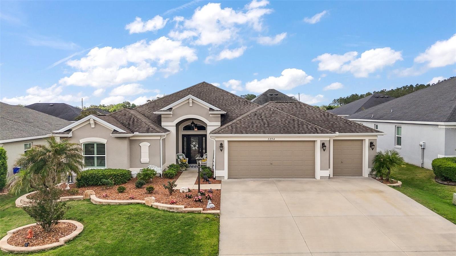 * * NEW PRICE * * No Age Restrictions * * No Bond * * Welcome to one of the most exquisite homes in the esteemed community of Oxford Oaks. As you approach this spectacular property, you'll be captivated by its attractive curb appeal, featuring meticulously landscaped grounds and a welcoming façade. Upon entry, you're greeted by a refined foyer that sets the tone for the elegance found throughout this residence.
On the left side of the home, you'll discover three spacious bedrooms; each thoughtfully designed to offer comfort and privacy. These versatile spaces can adapt to your needs, whether as bedrooms, home offices, or hobby rooms. Adjacent to these bedrooms is a well-appointed guest bathroom, featuring modern fixtures and finishes, ensuring convenience for visitors.
As you make your way through the bright, airy open floor plan, you'll be impressed by the elegant kitchen, dining, and living room combination, creating an ideal space for gatherings. The kitchen is designed for both functionality and style, featuring breakfast bar seating with pendant lighting, ample counter space, a pantry with pull-out shelves, modern stainless steel appliances, and a cozy nook perfect for casual meals.
From the living room, you access the charming primary bedroom, featuring a tray ceiling that adds a touch of elegance. The en-suite bathroom offers a roman shower, dual sinks, a private toilet, and an oversized walk-in closet with shelving, providing ample storage space. This suite serves as a tranquil retreat, combining luxury and practicality for your comfort.
Both the living room and the nook are equipped with sliding glass doors that open to the remarkable screened-in lanai with a saltwater pool, featuring a soothing waterfall where you can relax and entertain friends.
Adjacent to the kitchen, you'll find the laundry room equipped with a utility sink and cabinets, leading to the two-car and golf cart garage, both featuring motion sensor lights. These provide convenience by automatically activating when movement is detected. The garage offers ample closet space for additional storage, and houses the water filtration system.
The tasteful upgrades of this home and evident pride of ownership will not disappoint. The residence features crown molding, cornices, plantation shutters, and several pocket doors. The pool area is equipped with a safety fence, alarm, solar heating, pull-down shades, colored lights and new salt cell. Both the front and garage entry doors are fitted with pull-out (retractable) screens.
Oxford Oaks is a golf cart-friendly community, making it easy to access a variety of amenities, including mailboxes, a playground, a large resort-style pool, tennis courts, pickleball courts, and outdoor exercise equipment.
The home is conveniently located near The Villages Charter School, Fresh Market, Publix, Walmart and The Villages Town Squares, which offer a variety of shops, restaurants, and free nightly entertainment. All information provided in this report is believed true and accurate at data entry but not guaranteed.