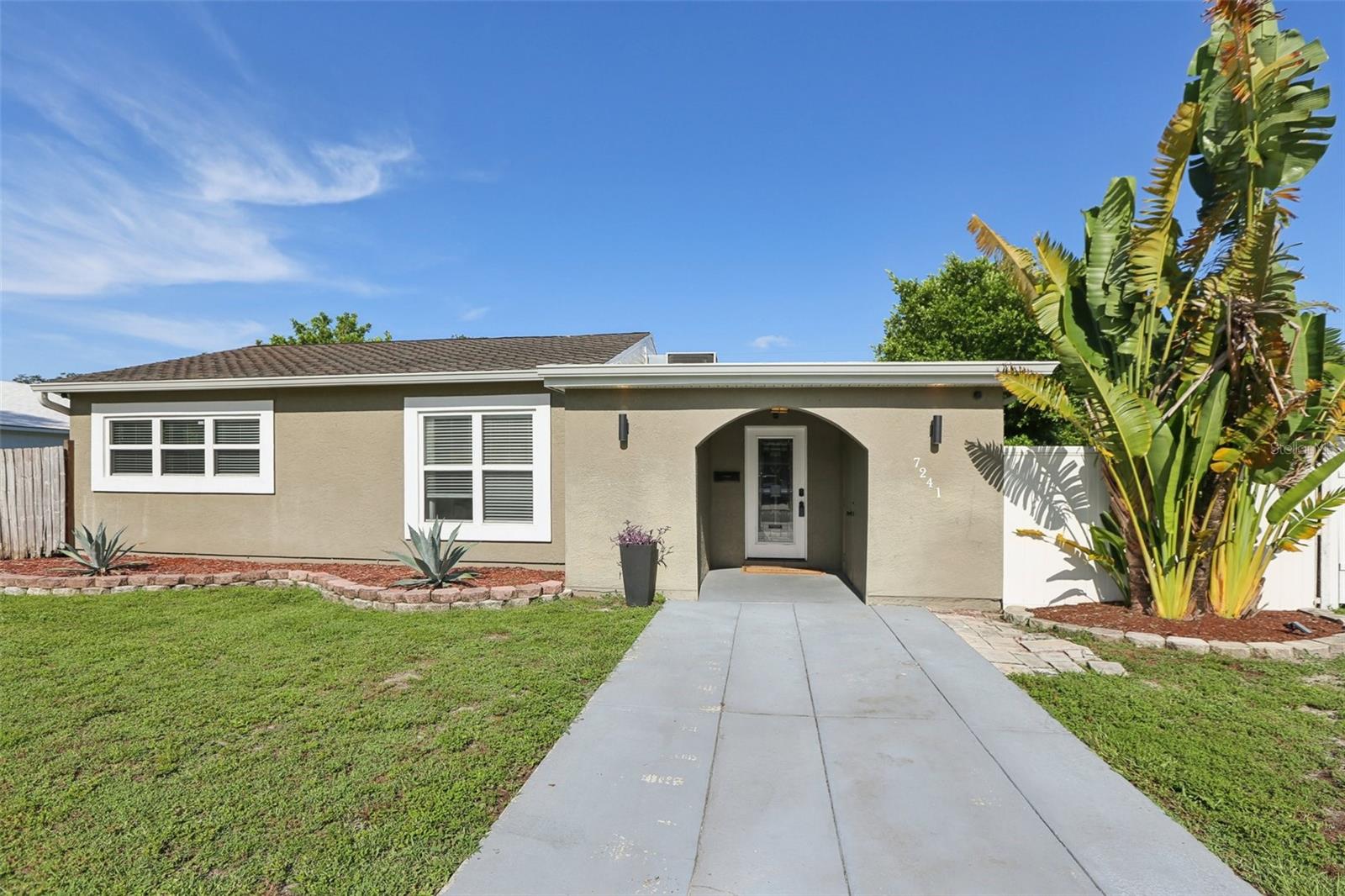 Welcome to this exceptional 4-bedroom, 2-bathroom home in the highly sought-after Meadowlawn neighborhood. At 1,545 square feet, this home's split floor plan offers both communal living and private retreats. Hurricane season? No problem. This home was completely high and dry during recent storms, and a low, transferable flood policy offers added peace of mind. Inside, you'll find a recently renovated kitchen featuring luxurious finishes and high-end appliances. The home's two distinct living and family rooms, accented by elegant crown molding, are perfect for all your family gatherings. With built-in speakers and recessed LED lighting, this space is equally suited for lively entertaining or a quiet evening at home. Beyond the aesthetics, this home comes with a host of brand-new updates, including new appliances, new fixtures, new interior and exterior paint, and new floors in all bedrooms and the family room. The large backyard provides plenty of room for RV or boat parking, and with no HOA or CDD fees, you have the freedom to truly make the space your own. Living here means being part of an active north St. Pete community. You'll be less than a quarter-mile from Fossil Park, the library, Sunshine Lanes bowling, Target, and a variety of restaurants and pickleball courts. This is a perfect community for those who enjoy golf cart rides, walking, biking, and fishing. Your major investments are also well-covered: a newer A/C unit, a water heater that's only a year and a half old, an updated electrical system with a new electrical panel, and newer Low-E high-efficiency windows all provide long-term security. The roof was last updated in 2014. This is more than a house—it's a move-in-ready home built for a vibrant, convenient St. Pete lifestyle. Schedule your private showing today.