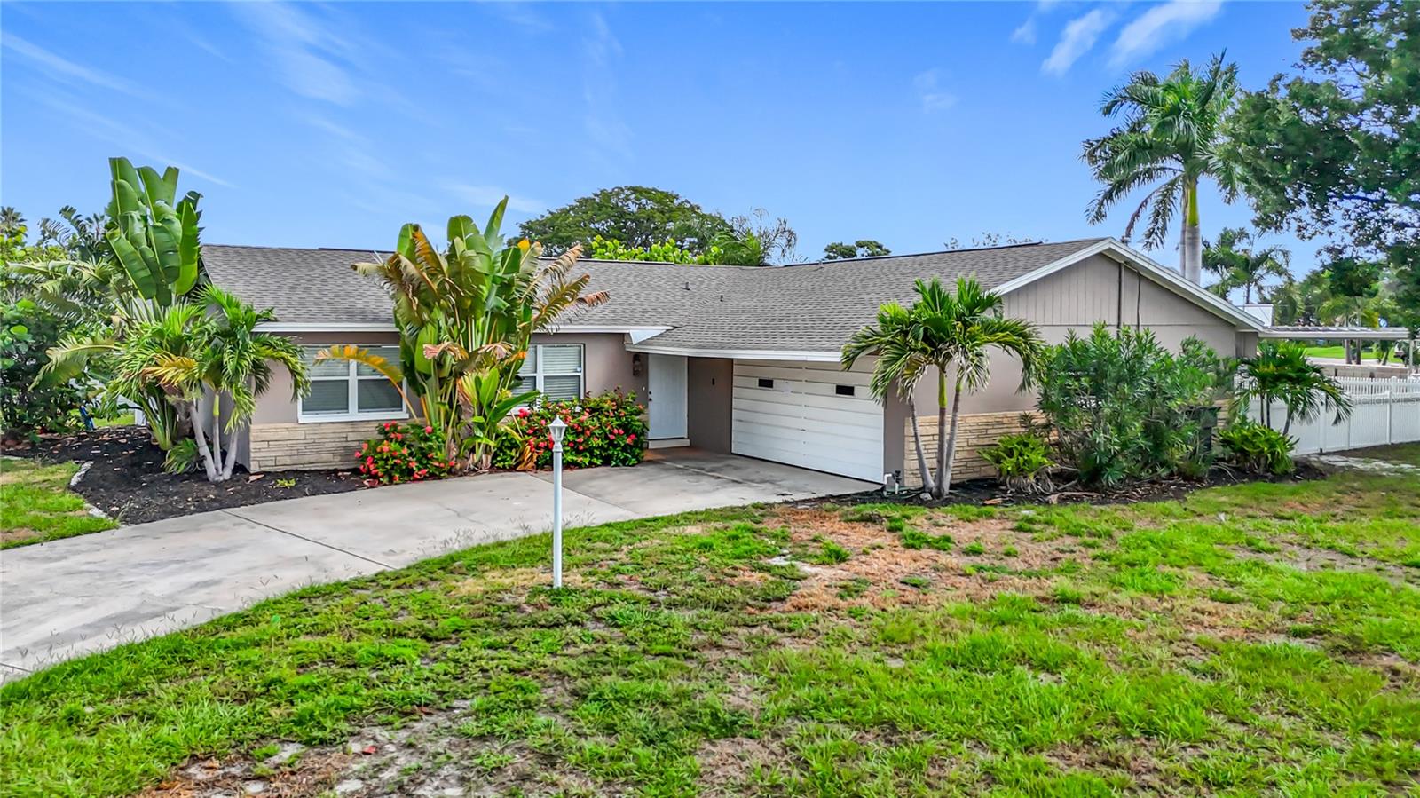 Discover your dream waterfront retreat at 10701 Donbrese Ave, Tampa, FL 33615, nestled in the highly sought-after Tampa Shores subdivision. This beautifully updated 3-bedroom, 2-bathroom single-story canalfront home, built in 1966, offers 1,512 sq. ft. of modern living space on a spacious ¼-acre corner lot. Step inside to an inviting open floor plan with fresh interior paint, showcasing a bright and airy layout perfect for both relaxation and entertaining. The updated kitchen is a chef’s delight, featuring ample wood cabinetry, sleek granite countertops with a central island, and top-of-the-line stainless steel appliances. Outside, the home boasts a brand-new 2025 roof and a large, fenced rear yard that backs up to a serene canal, ideal for boating enthusiasts with direct access to Tampa Bay and the Gulf of Mexico. The attached 2-car garage provides ample storage and convenience. Tampa Shores offers exclusive community amenities, including a private man-made beach and boat ramp for residents, perfect for enjoying Florida’s coastal lifestyle. Currently zoned for A-Rated Alonso High School. Just minutes away, explore vibrant attractions within 20 miles, such as Busch Gardens (8 miles) for thrilling rides, the Tampa Riverwalk (10 miles) for scenic strolls, and the pristine sands of Clearwater Beach (18 miles). Enjoy cultural experiences at the Tampa Museum of Art (10 miles) or catch a game at Raymond James Stadium (7 miles). With no HOA restrictions, this move-in-ready block home is a rare gem, blending modern upgrades with prime waterfront access in a location that puts Tampa’s best dining, shopping, and entertainment at your fingertips.