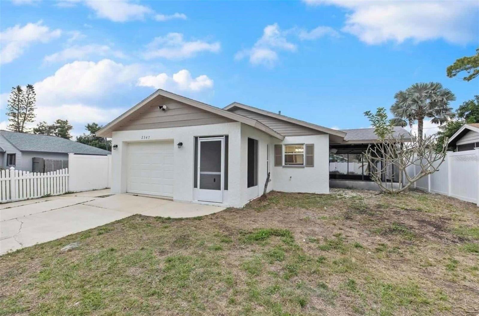 Fully Remodeled 2-Bedroom Home with Garage in Sunny Sarasota.
Step inside this beautifully updated 2-bedroom, 1-bathroom home with a 1-car garage and fall in love with its charm and thoughtful upgrades. The living room features vaulted ceilings with exposed beams, creating an open and inviting space. From the living and dining area, you can step out to the extended lanai—perfect for enjoying your morning coffee while listening to the birds.
Recent updates include a brand-new roof, brand-new AC, and fresh interior and exterior paint. The home is offered fully furnished, making it move-in ready for effortless living, privacy, and easy entertaining.
The kitchen has been completely remodeled with new cabinetry, quartz countertops, a stylish tile backsplash, and a full suite of stainless steel Energy Star appliances, including a newly added dishwasher for your convenience. The bathroom has also been refreshed with modern finishes, featuring a new vanity and toilet.
Additional improvements include new ceiling fans, light fixtures, mirrors, interior and exterior doors, smoke detectors, and updated hardware throughout.
Outside, you’ll find a large screened-in patio overlooking a private, fenced backyard—an ideal spot for relaxing or hosting guests.
Located in a quiet neighborhood with easy access to US-41, marinas, shopping, restaurants, and golf courses, this home perfectly blends comfort and convenience.
Schedule your showing today!